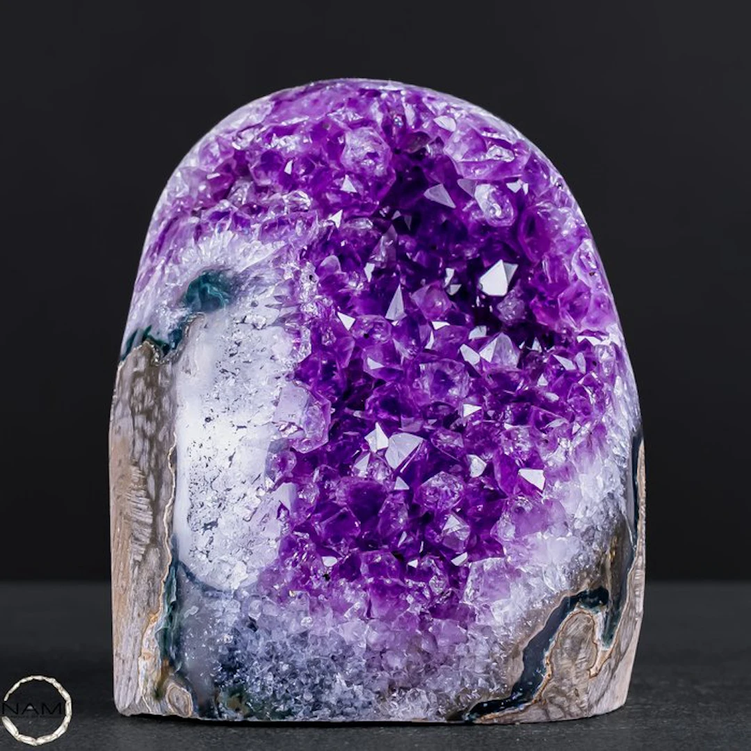 Amethyst druse with striking quartz crystals and...