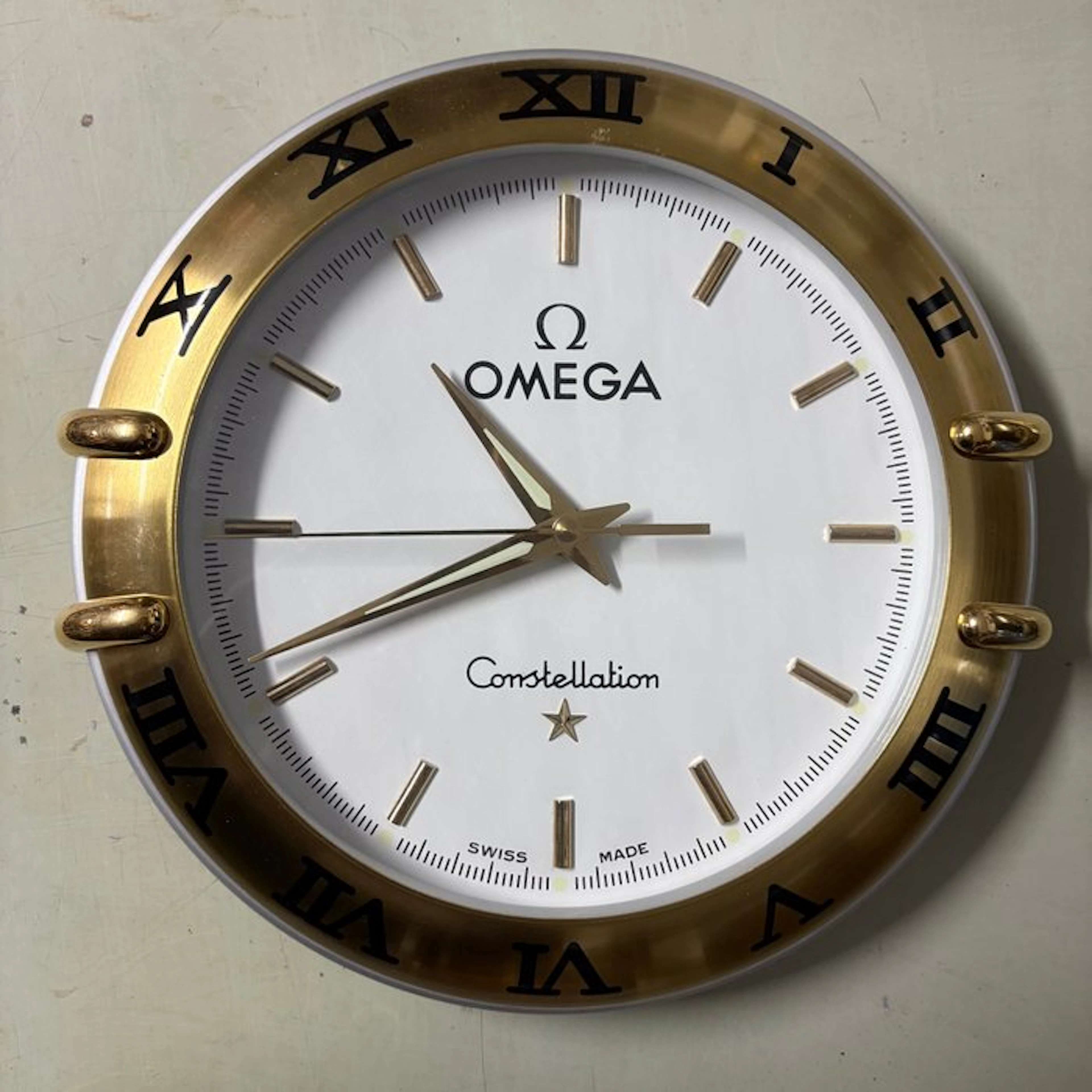 Clock - Omega by Ruegg - Metal - 2000-2010