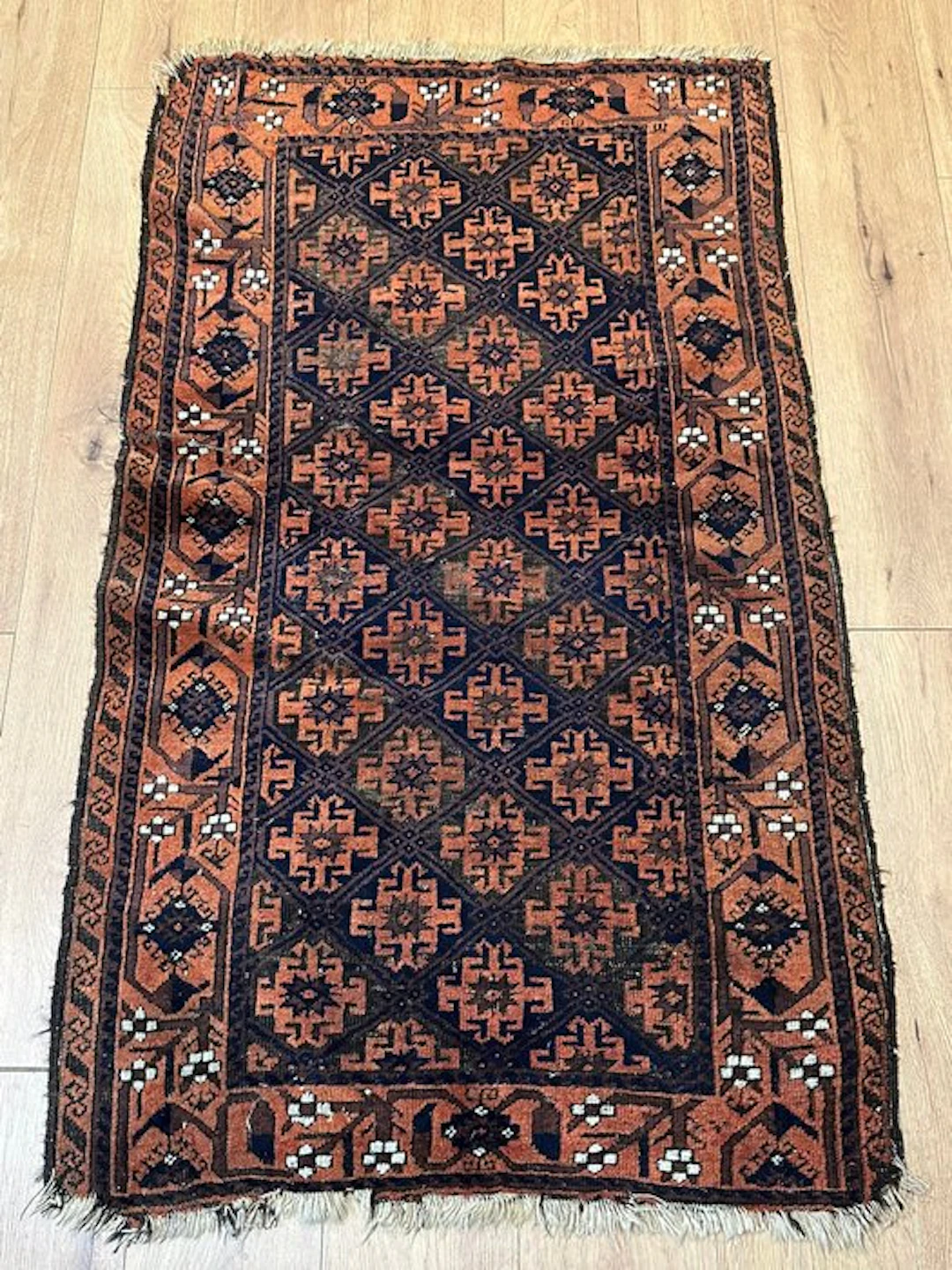 Hand-knotted Baluch rug from Afghanistan with a classic...