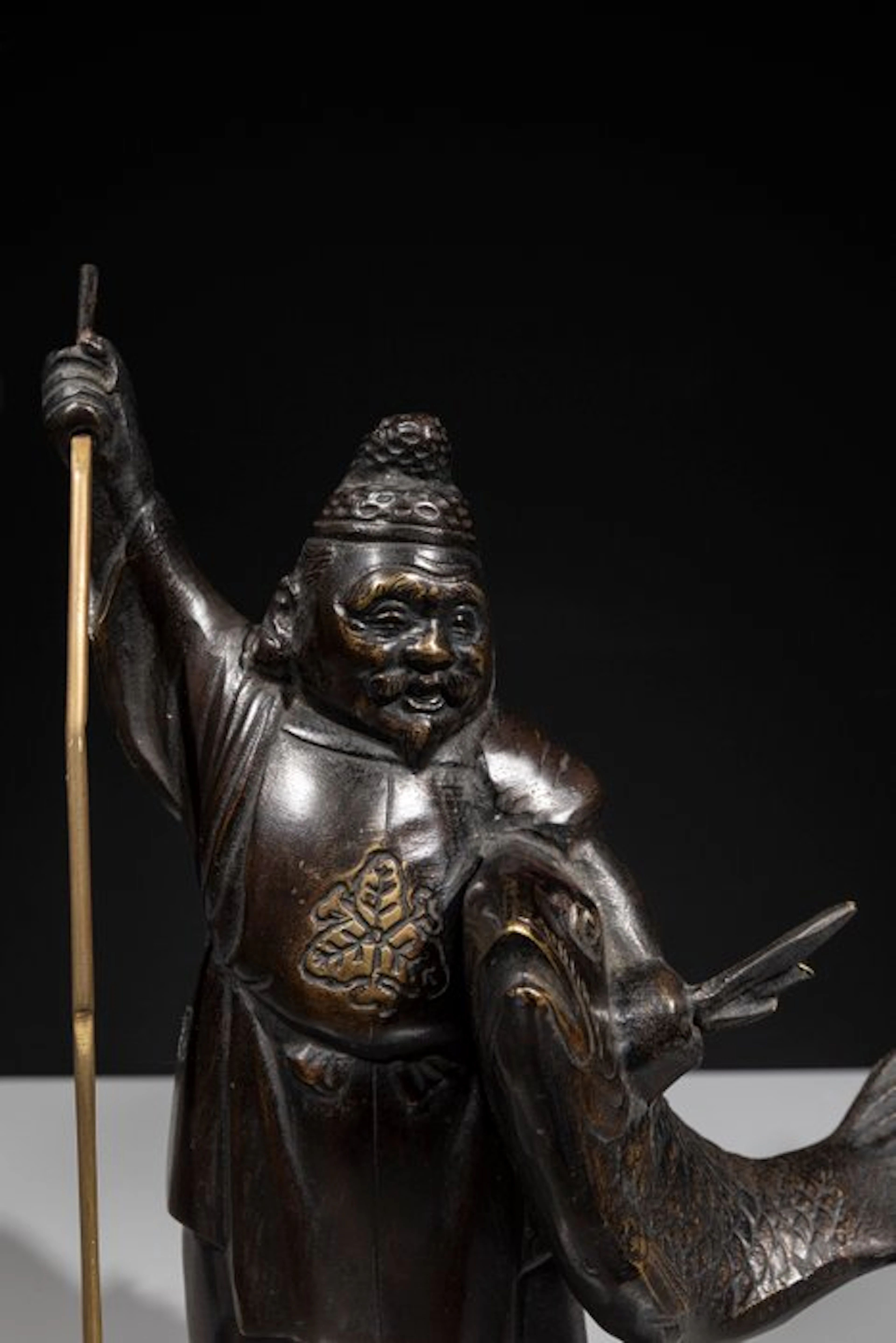 Patinated bronze - A bronze okimono of Ebisu (恵比寿)...