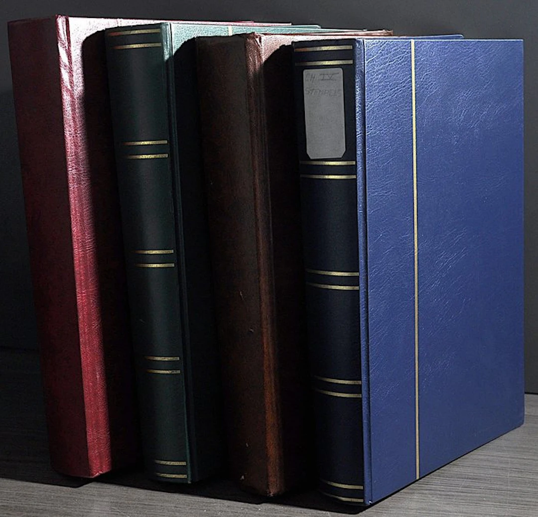 Accessories - A box full of four thick empty stock books...
