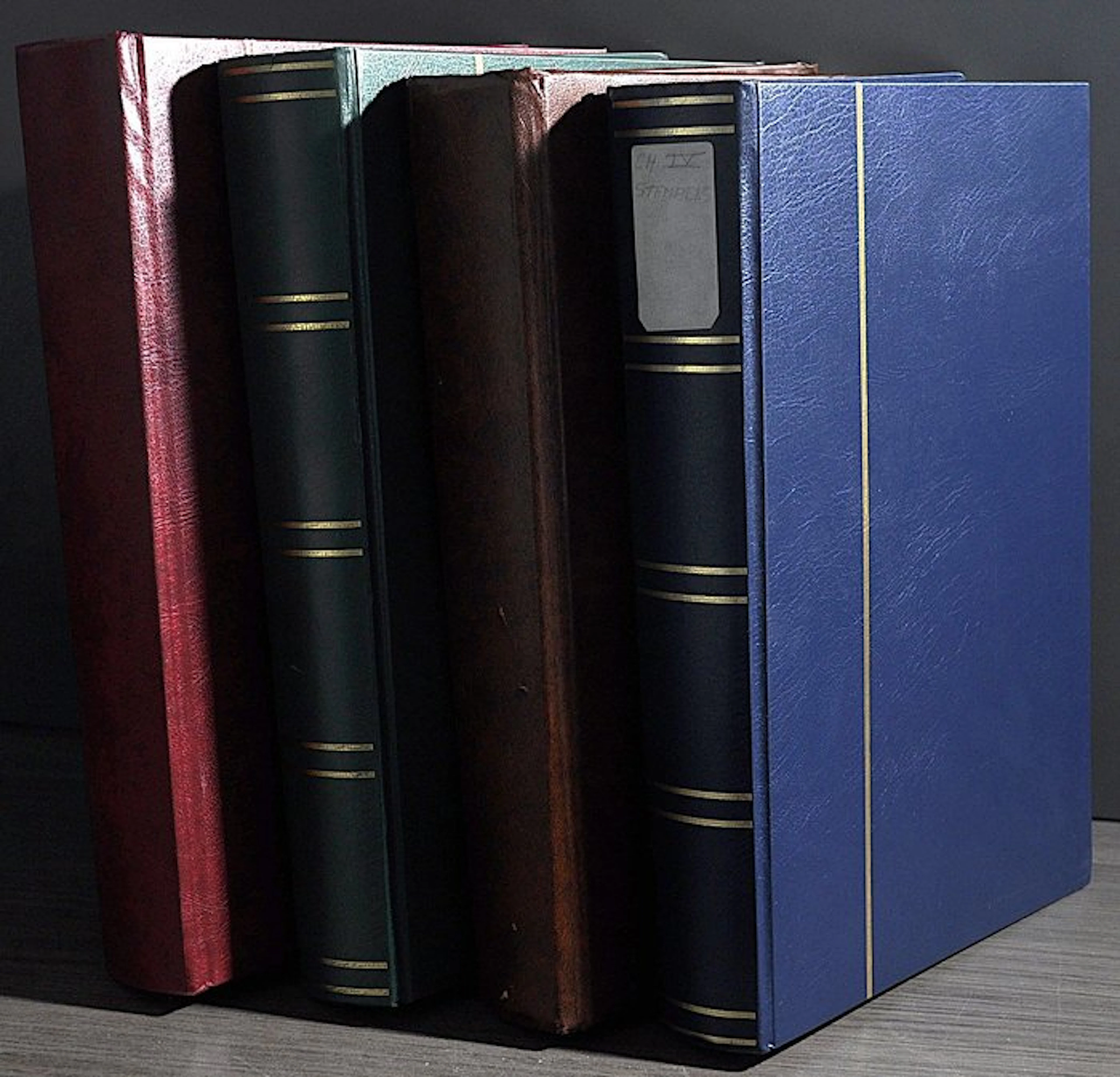 Accessories - A box full of four thick empty stock books...