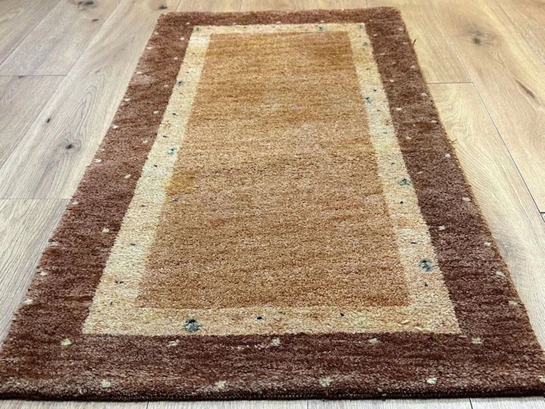 Hand-knotted Indo Gabbeh rug with a timeless frame design...