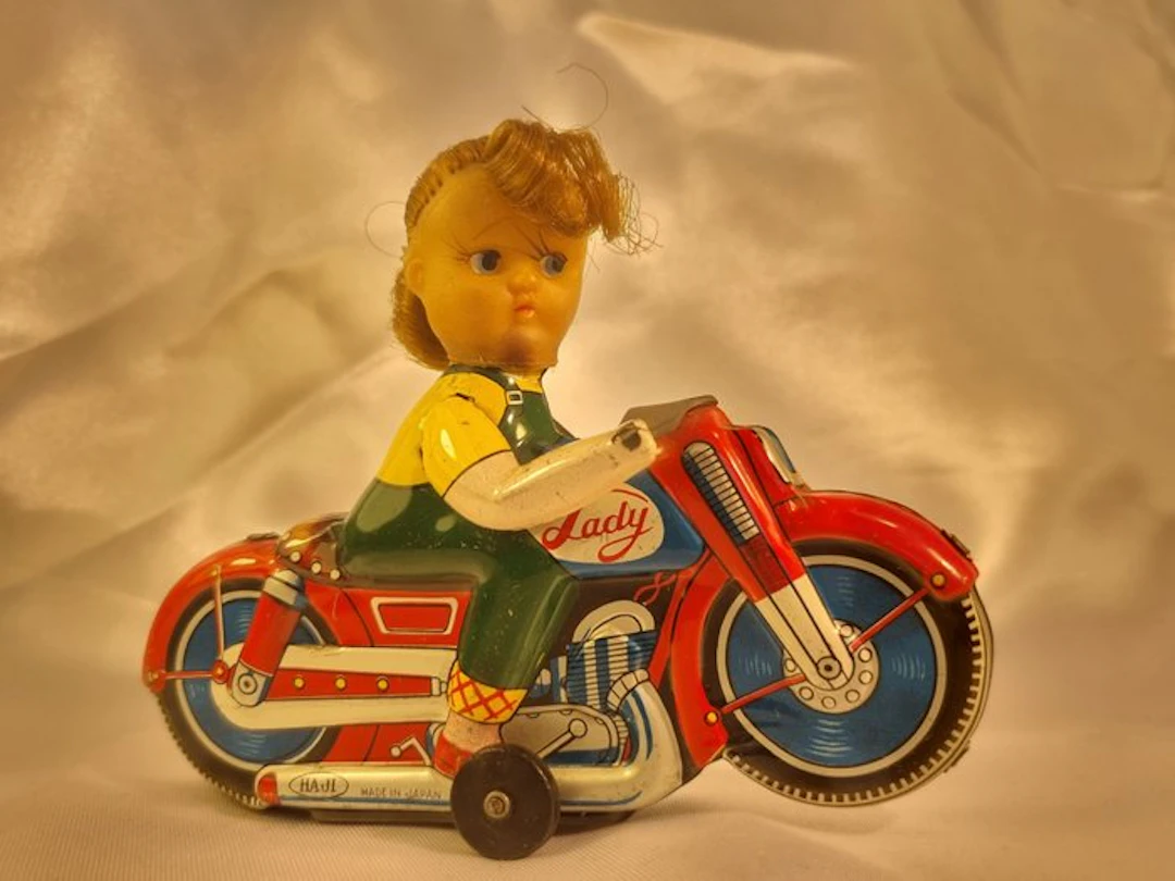 HAJI - Tin toy - Friction girl motorcycle (lady) with vinyl face & nylon hair