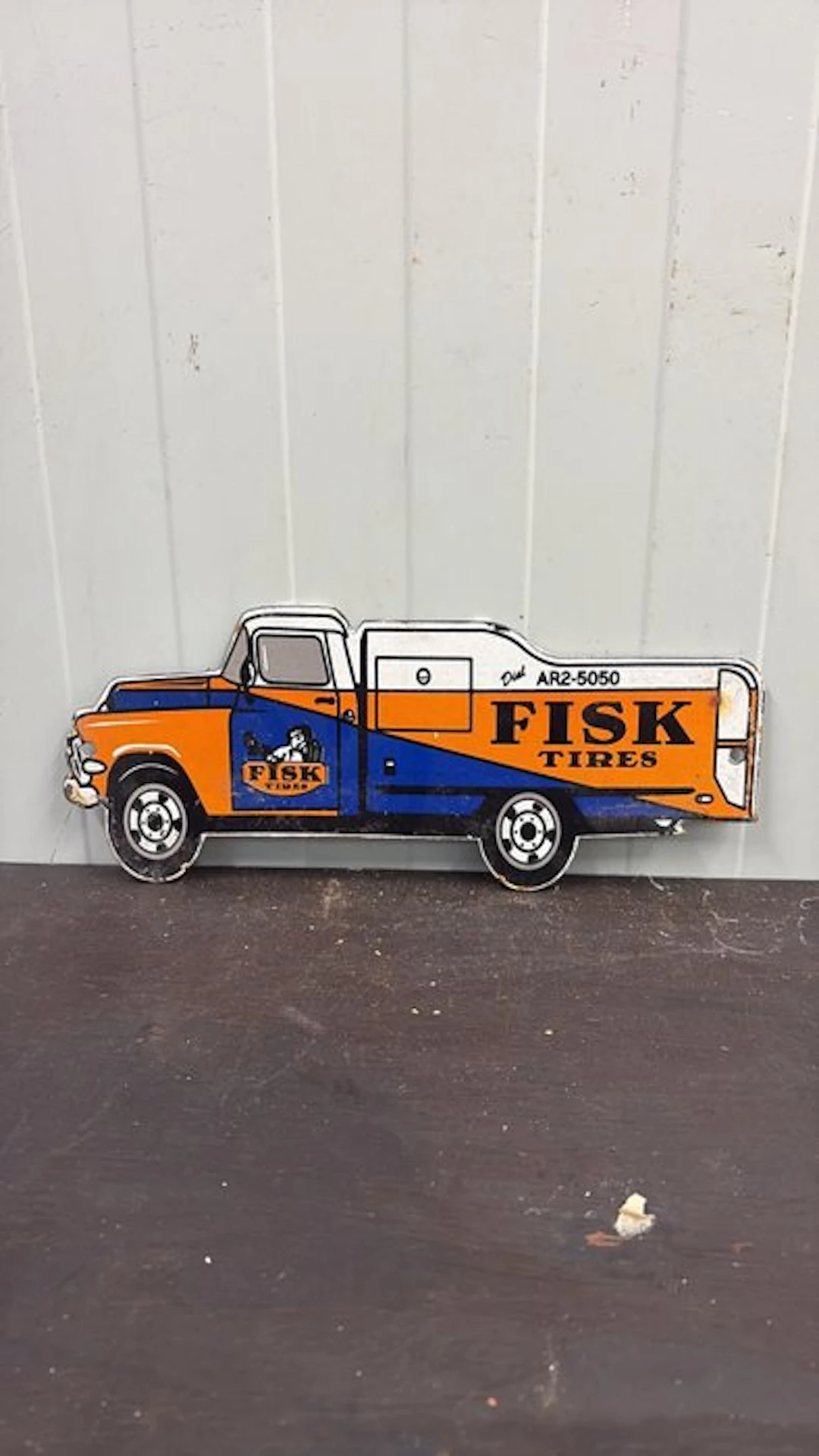 Fisk Tires – Pick-up Truck – Die-cut enamel advertising...