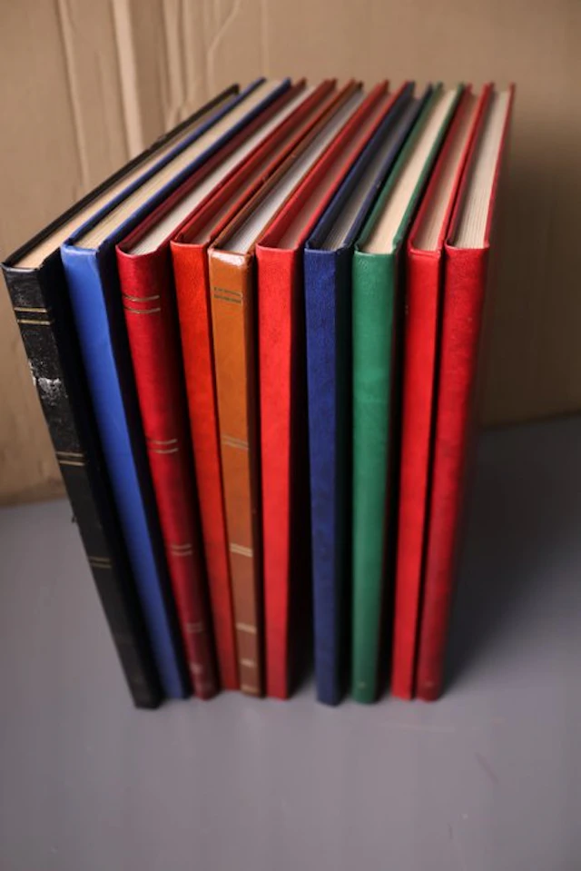 World - 10 blank stock books with white pages.