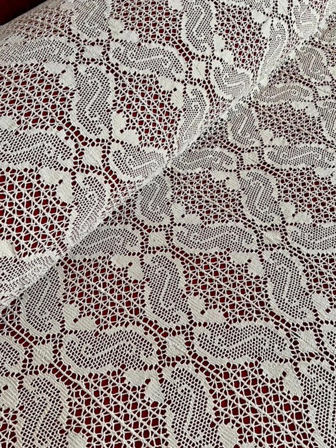 ** Antique cream-colored bobbin lace bedspread for double beds