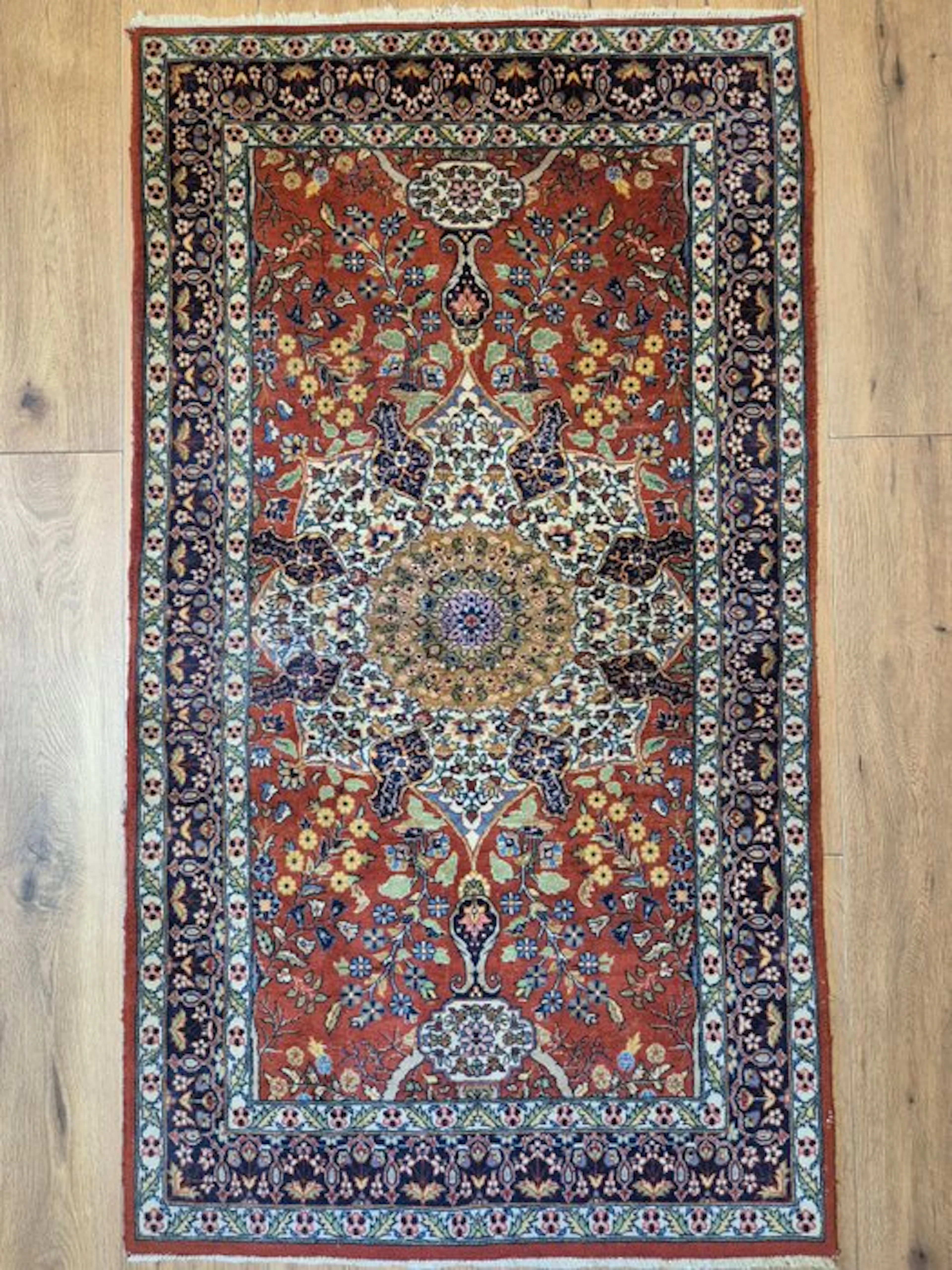 Fine cashmere Oriental rug in the Ghom pattern with an elegant central