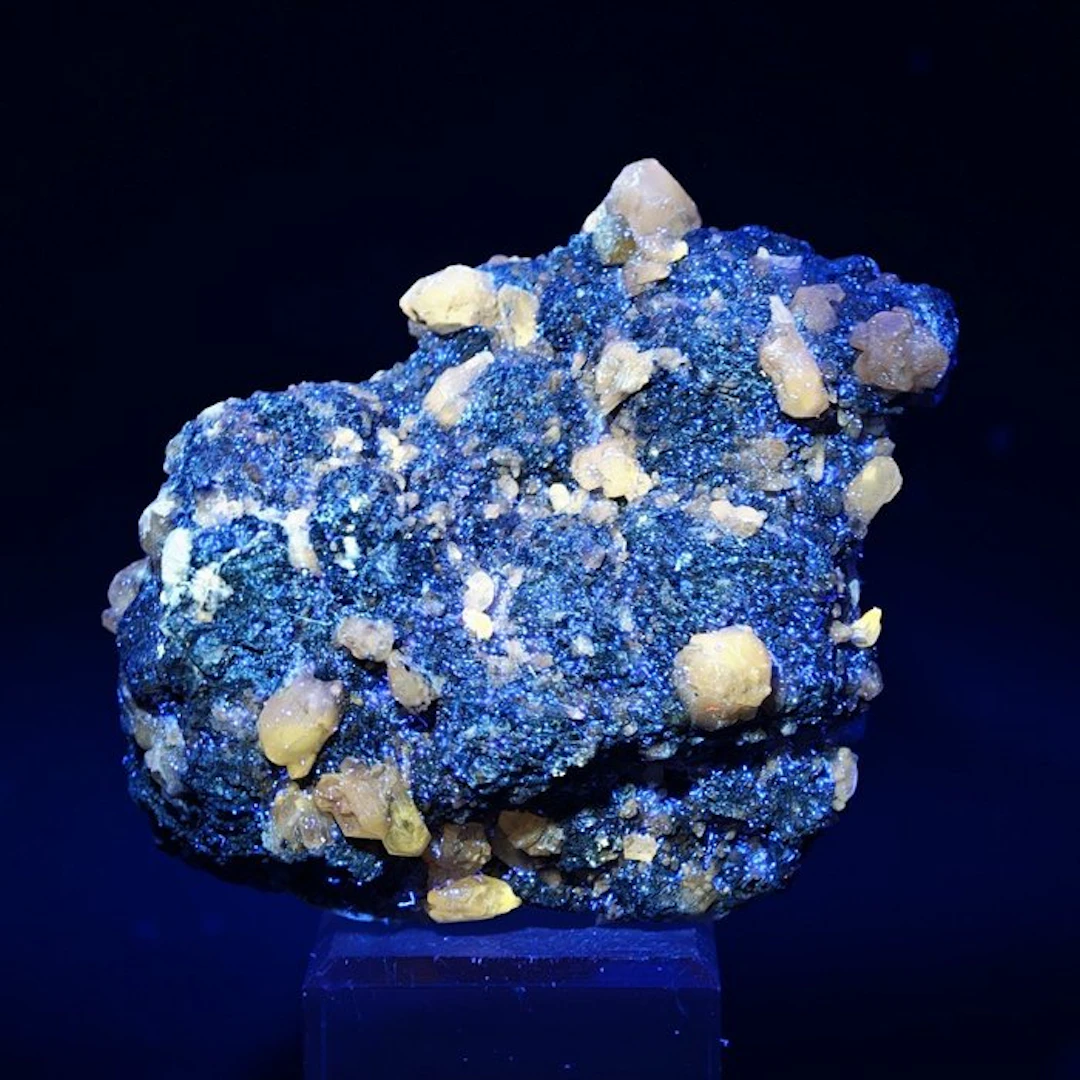 Rare fluorescent cerussite on gleaming galena