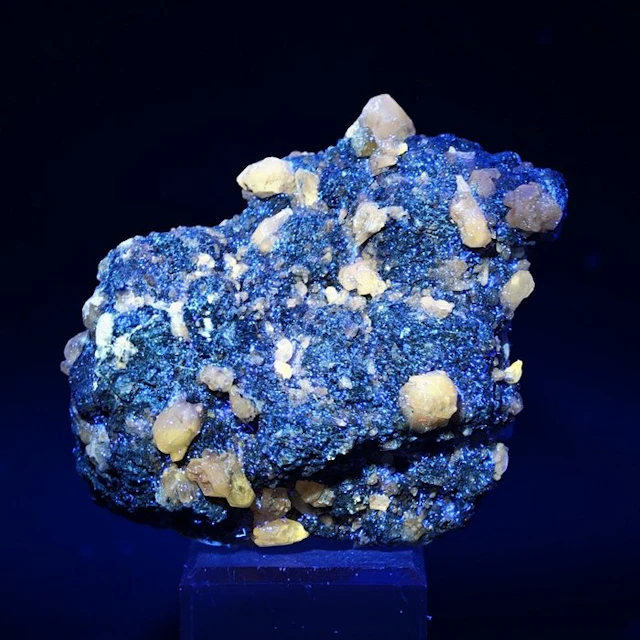 Rare fluorescent cerussite on gleaming galena