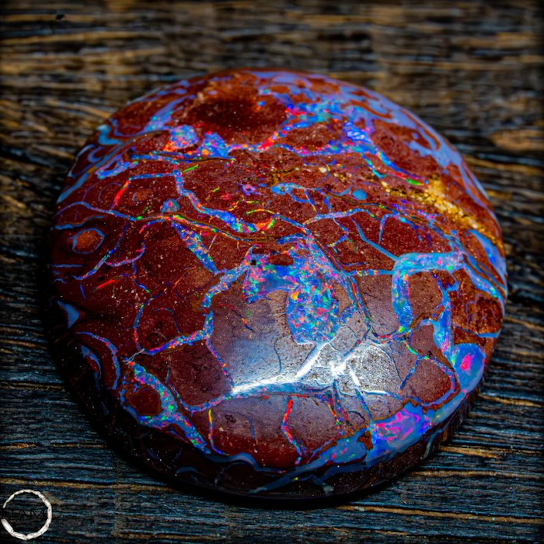 Australian Boulder Opal – Red matrix with iridescent...