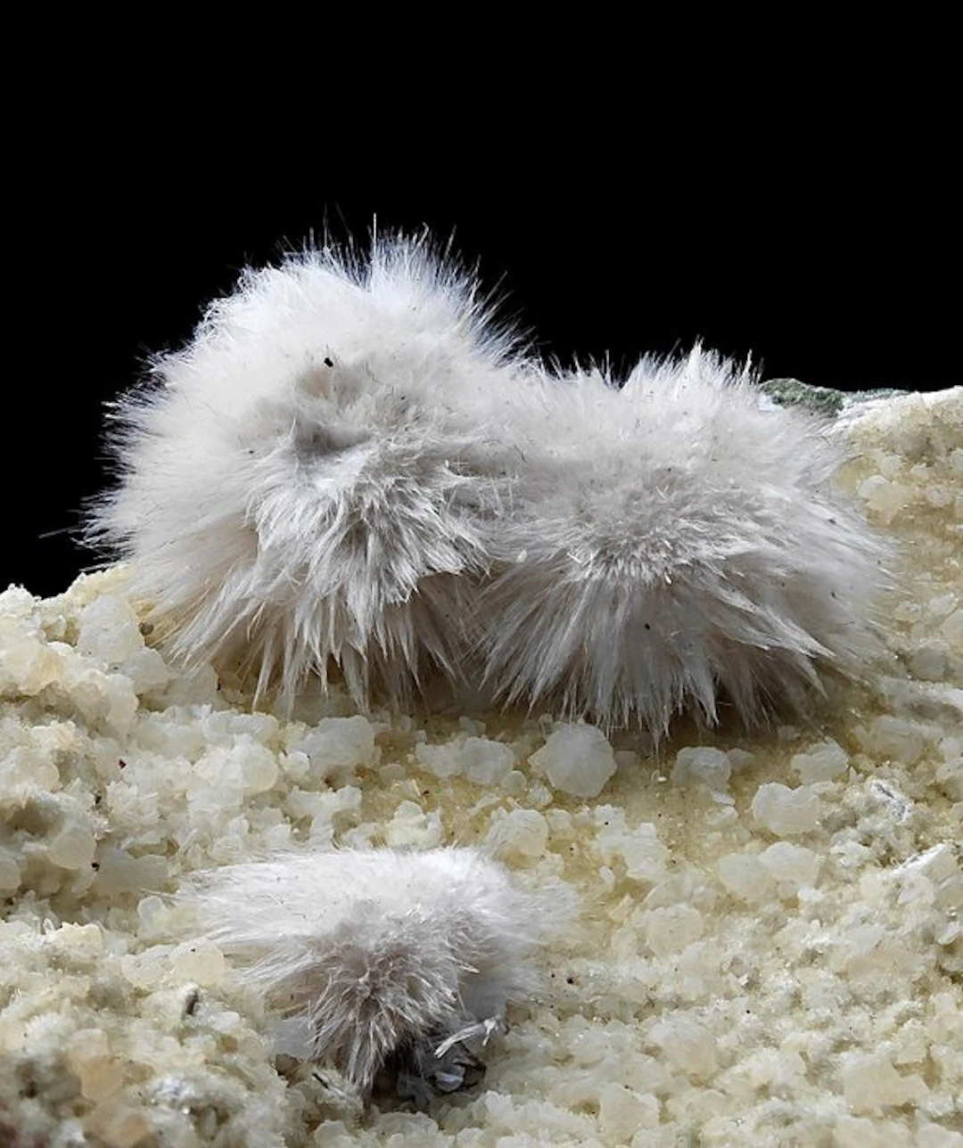 Hairy white okenite with gemmy calcite inclusions...