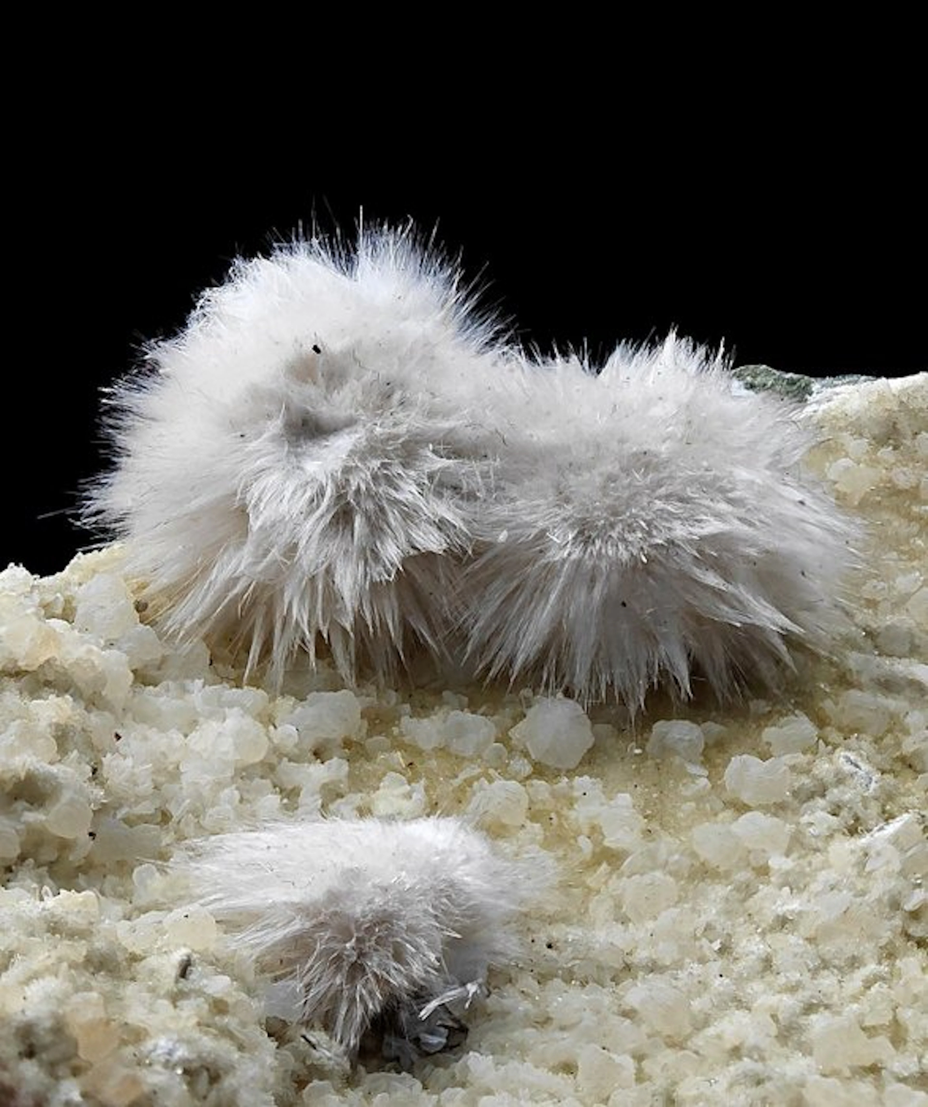 Hairy white okenite with gemmy calcite inclusions...