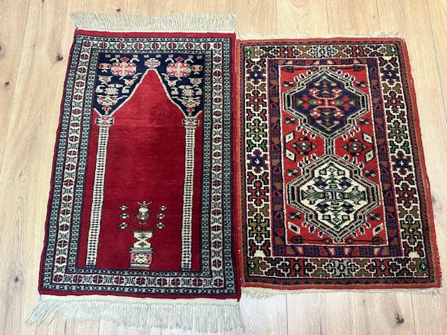 A pair of hand-knotted Oriental rugs in the traditional style