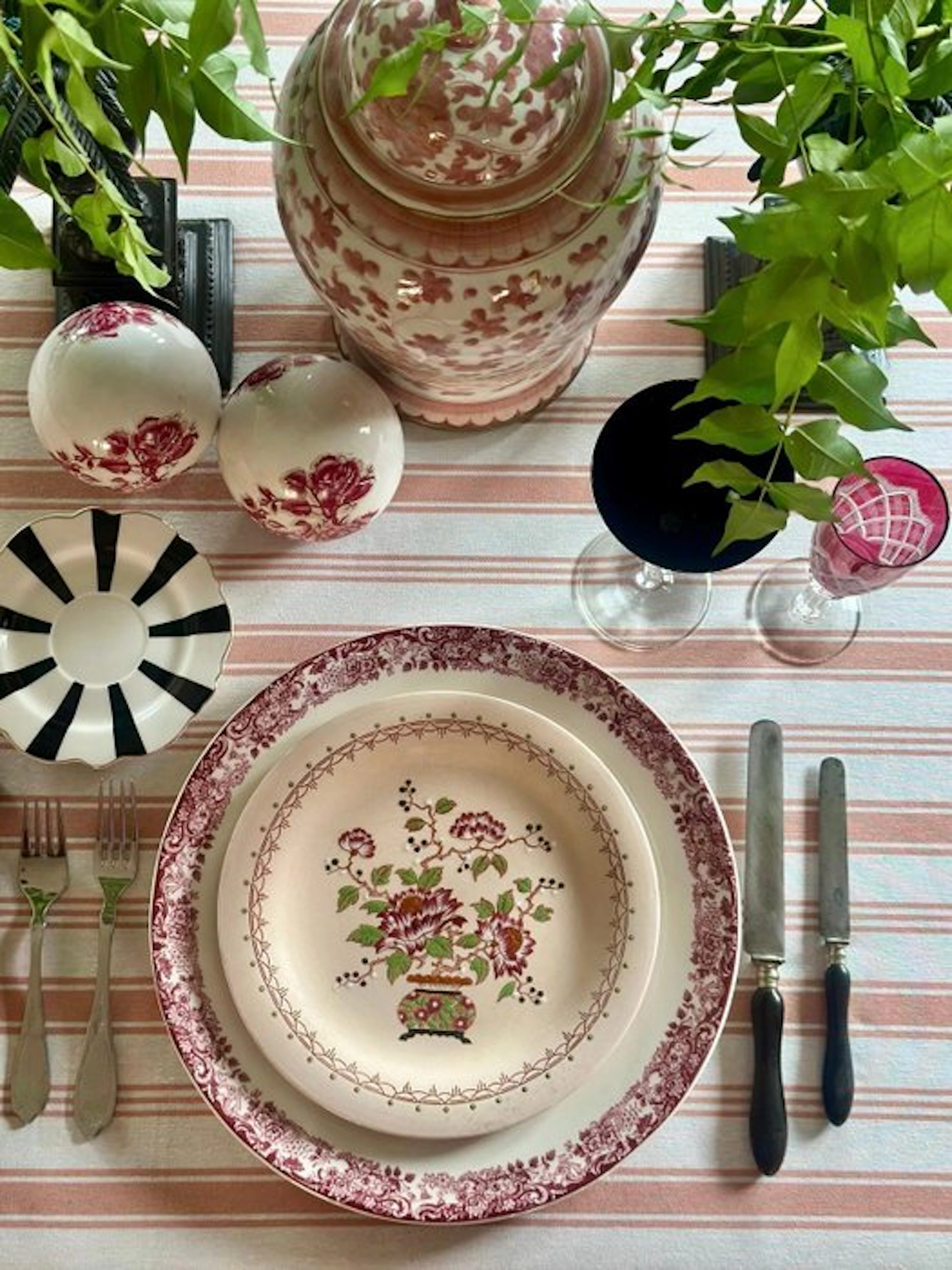 Salmon-colored Provençal-striped tablecloth on beige for large tables