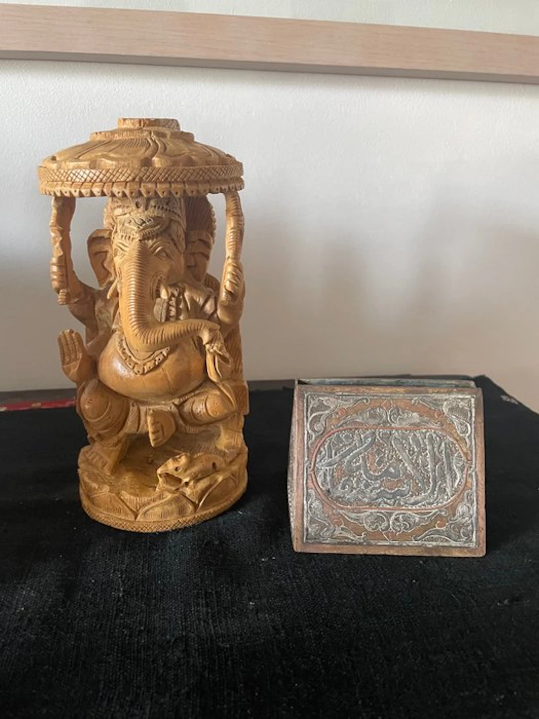 Carved wooden statue of Ganesh and an Islamic postman engraved in bronze/brass