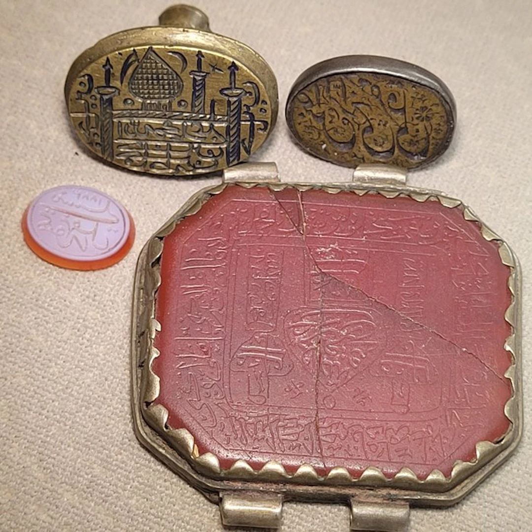 Collection of four decorative engraved seals/stamps...