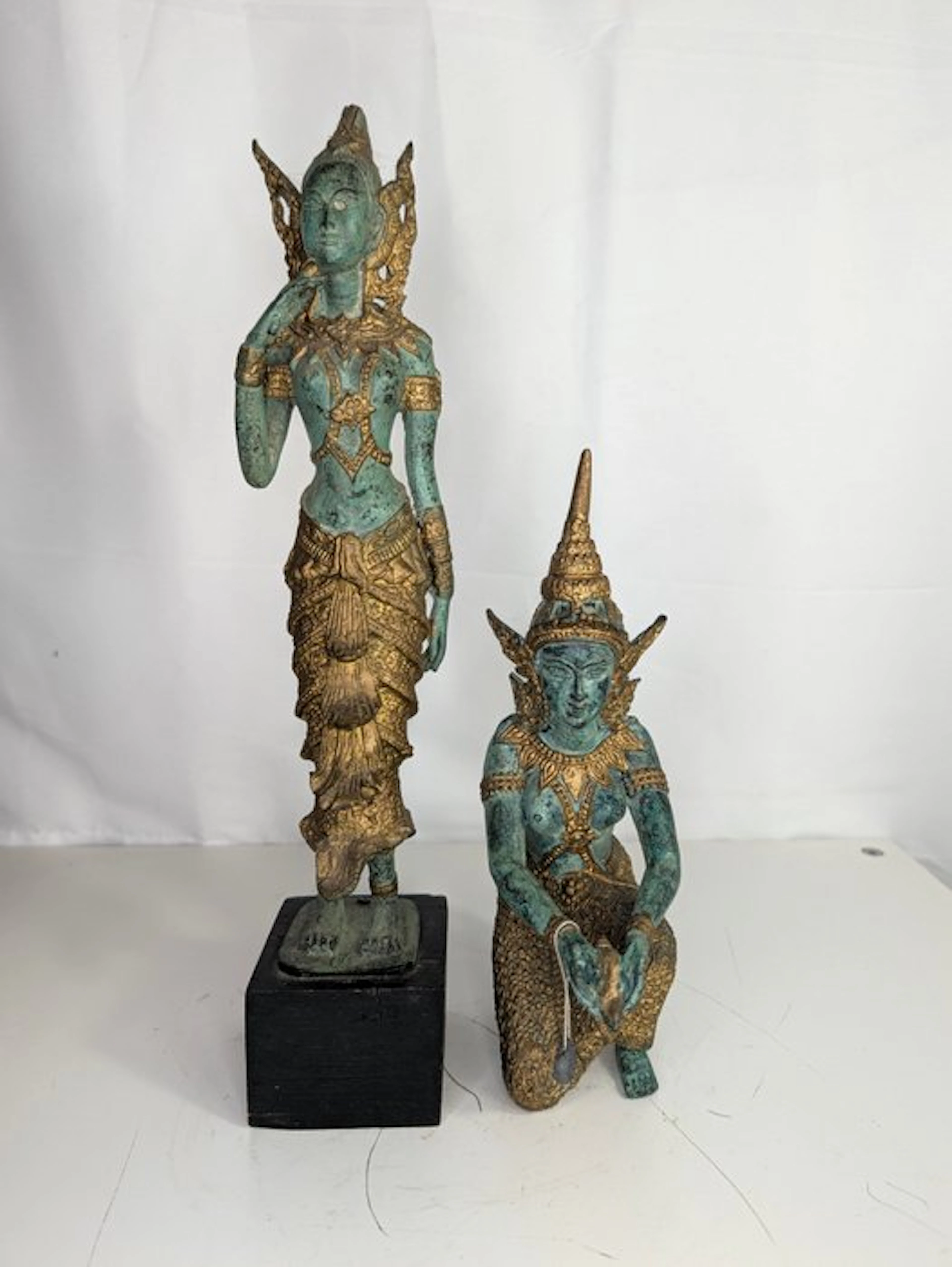 Bronze set – two Thai temple figures with green patina...
