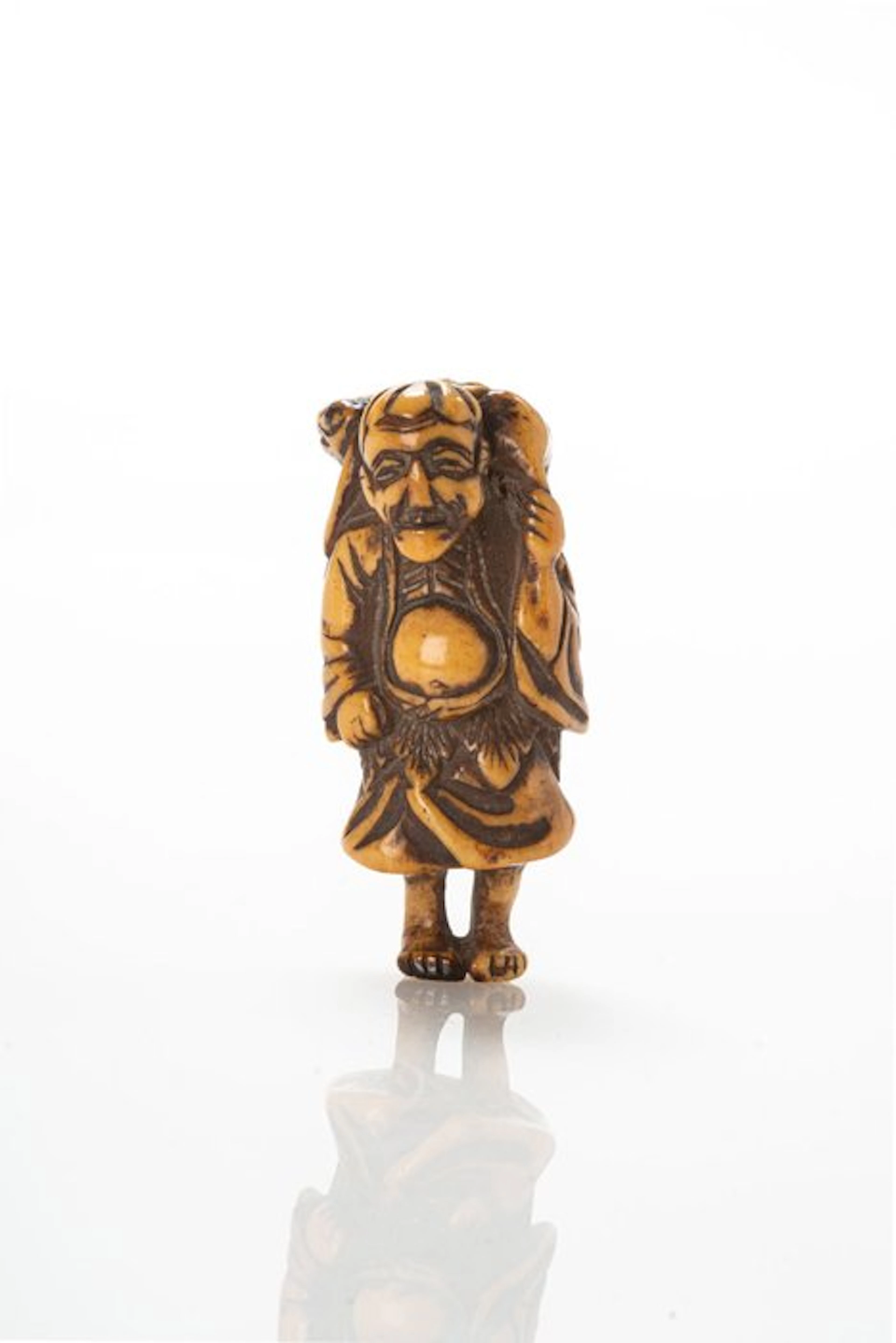 A lovely stag-antler netsuke of a Gama Sennin with a toad...