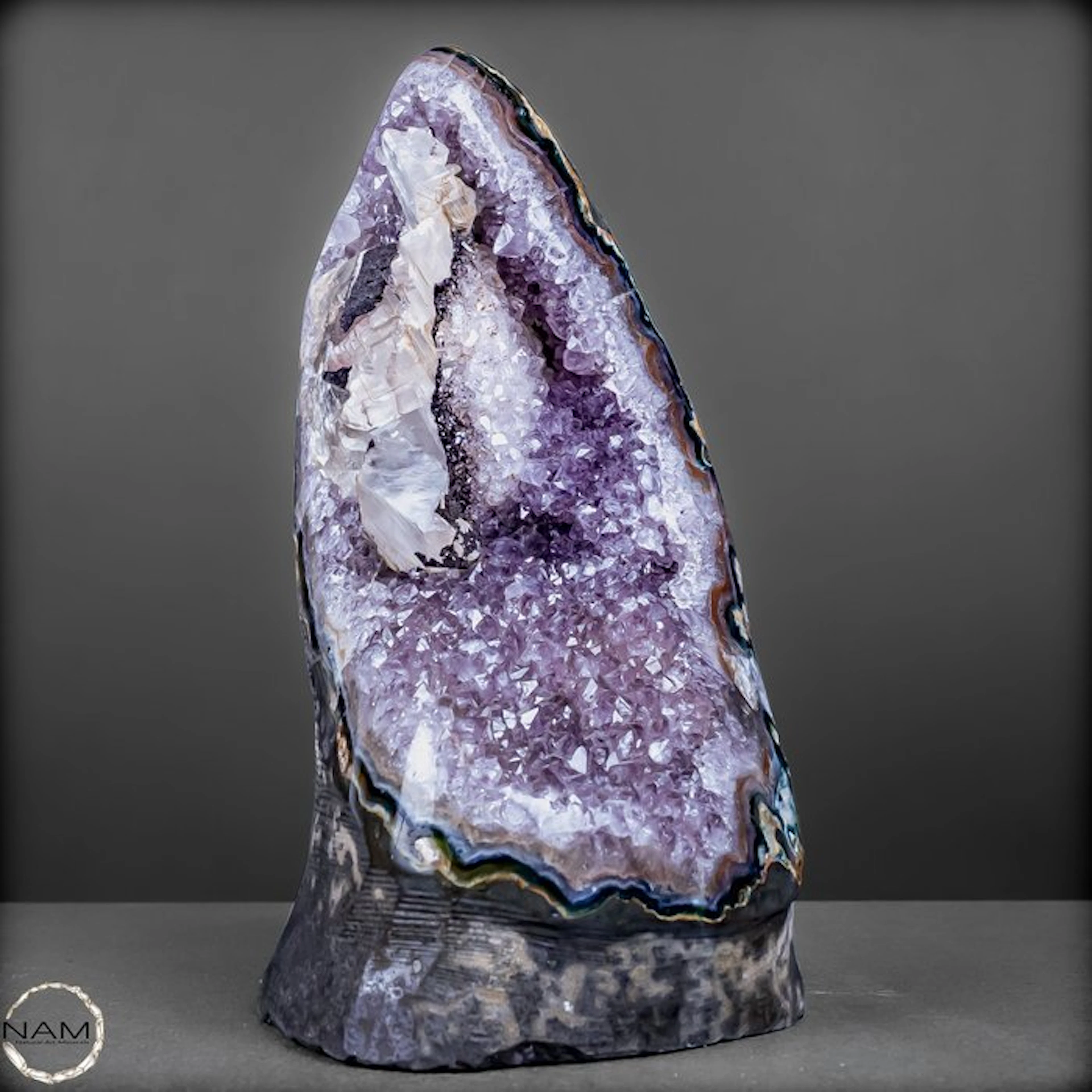 Natural amethyst crystal cathedral with calcite crystal...