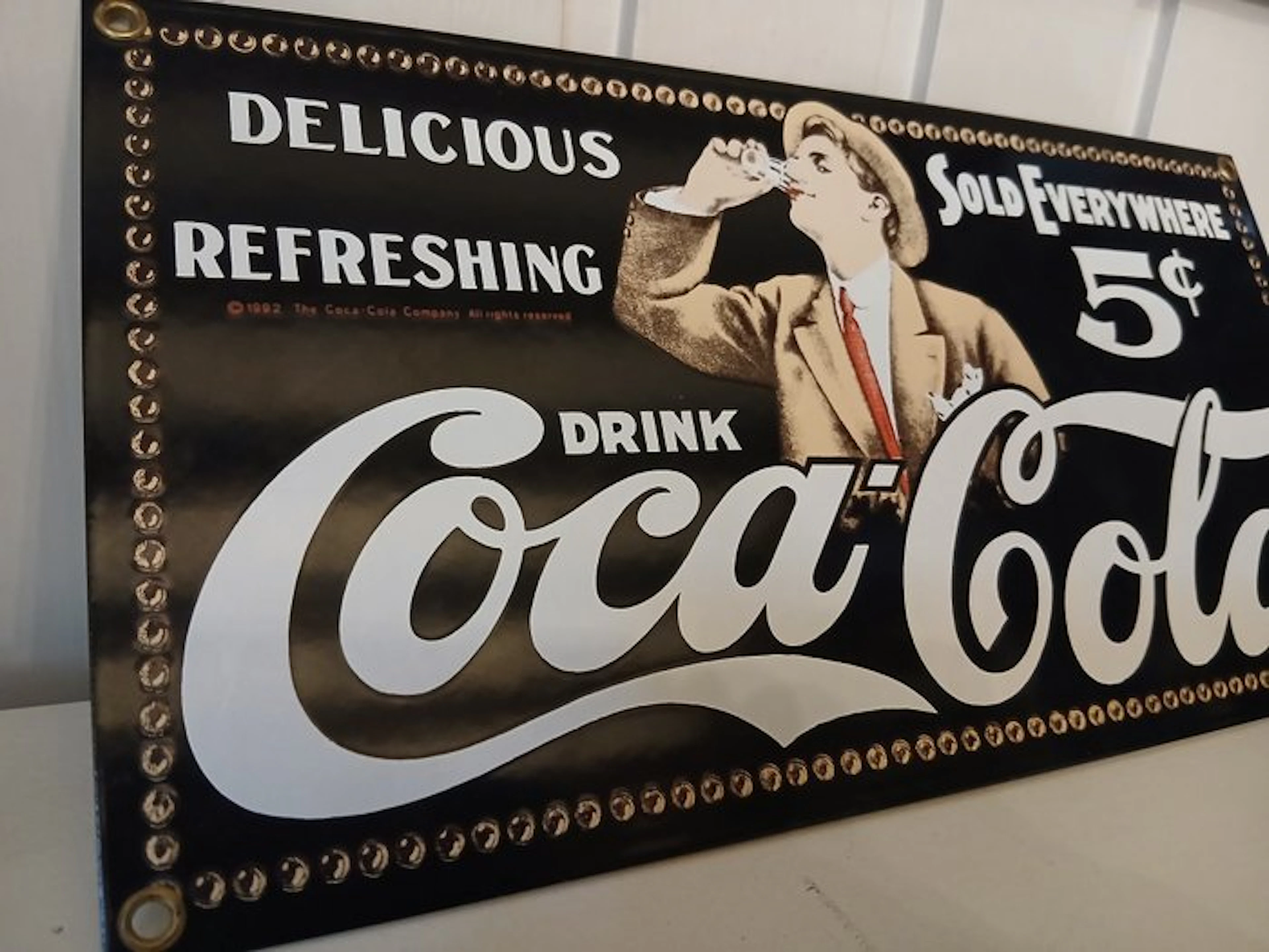 Coca-Cola Company - Coca-Cola enamel advertising sign...