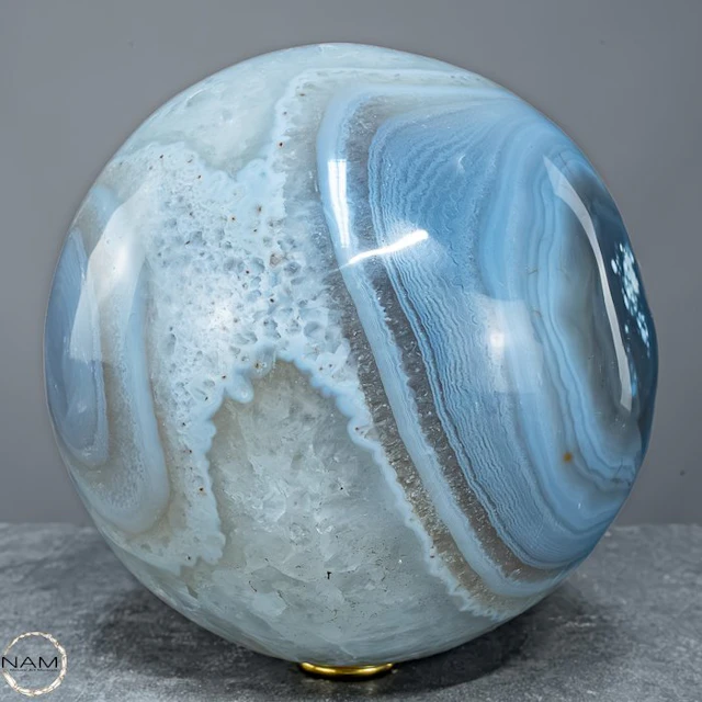 Exceptional Orca Agate Sphere with a white amethyst...