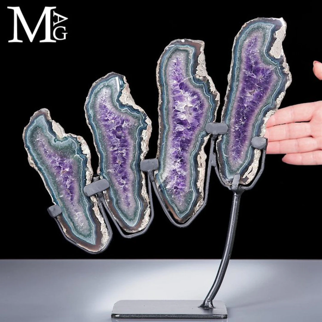 Artistic composition of amethyst geode slices on a stand