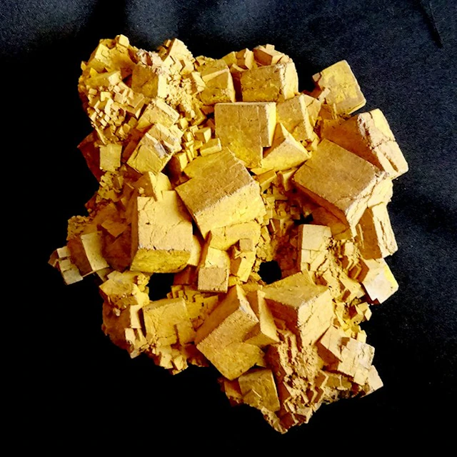 Aggregation of macle cubes of limonite pseudomorphic...