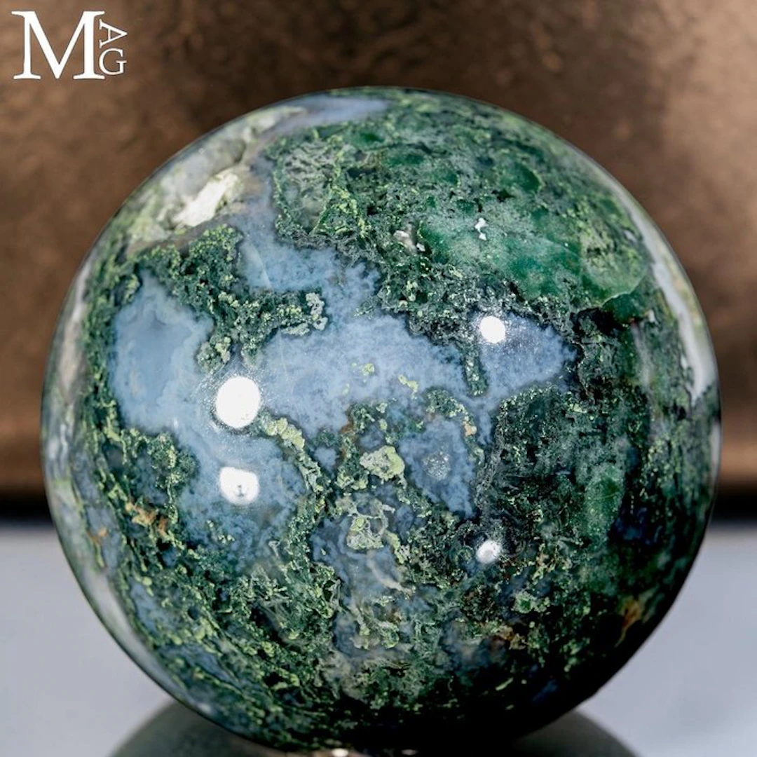 Vibrant green moss agate sphere