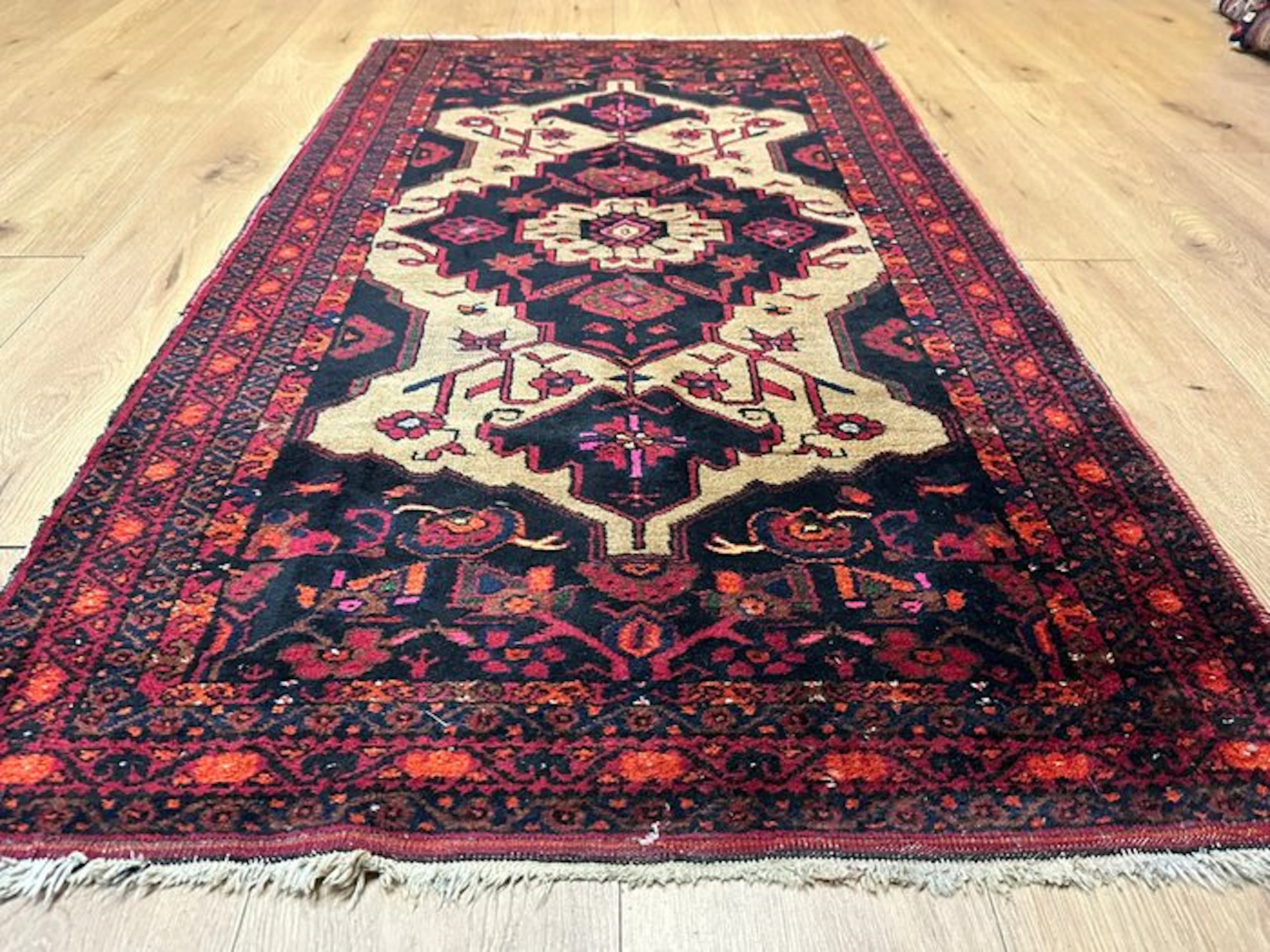 Hand-knotted antique Baluchi oriental rug with a...