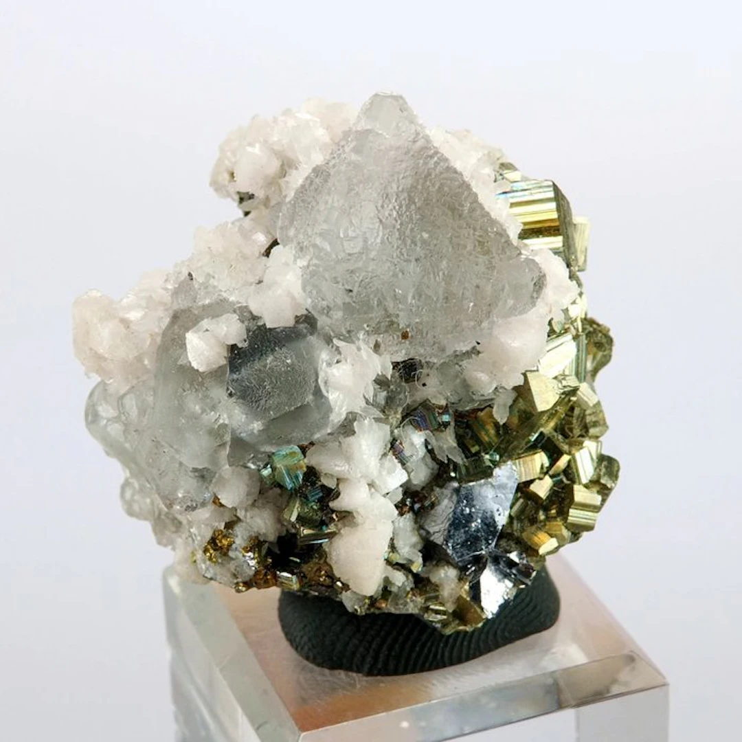 Fluorite (polysynthetic) with iridescent Pyrite and Calcite - Naica mine