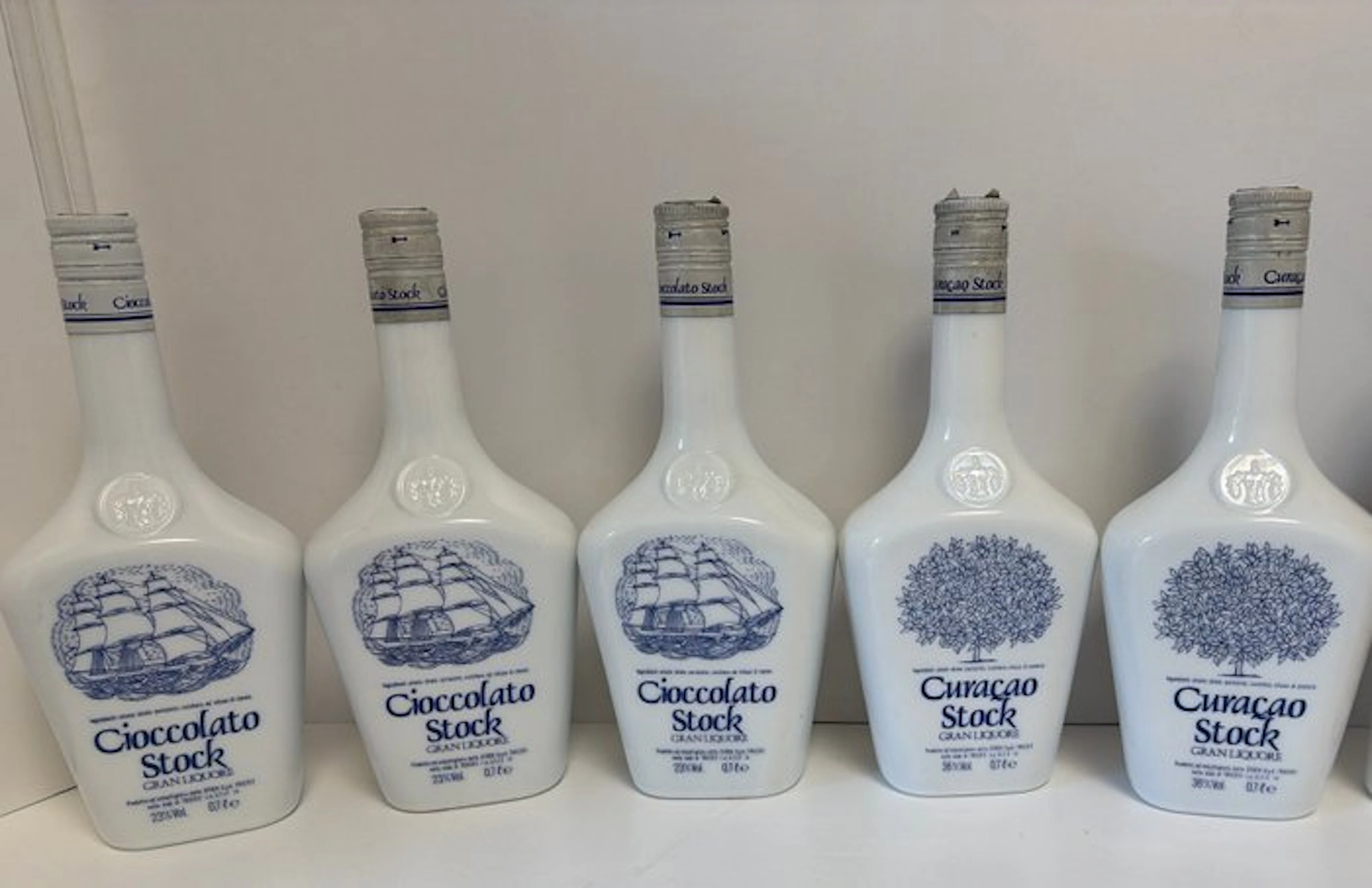 Stock - Curaçao + Cioccolato ceramic - b. 1980s - 70cl - 5 bottles