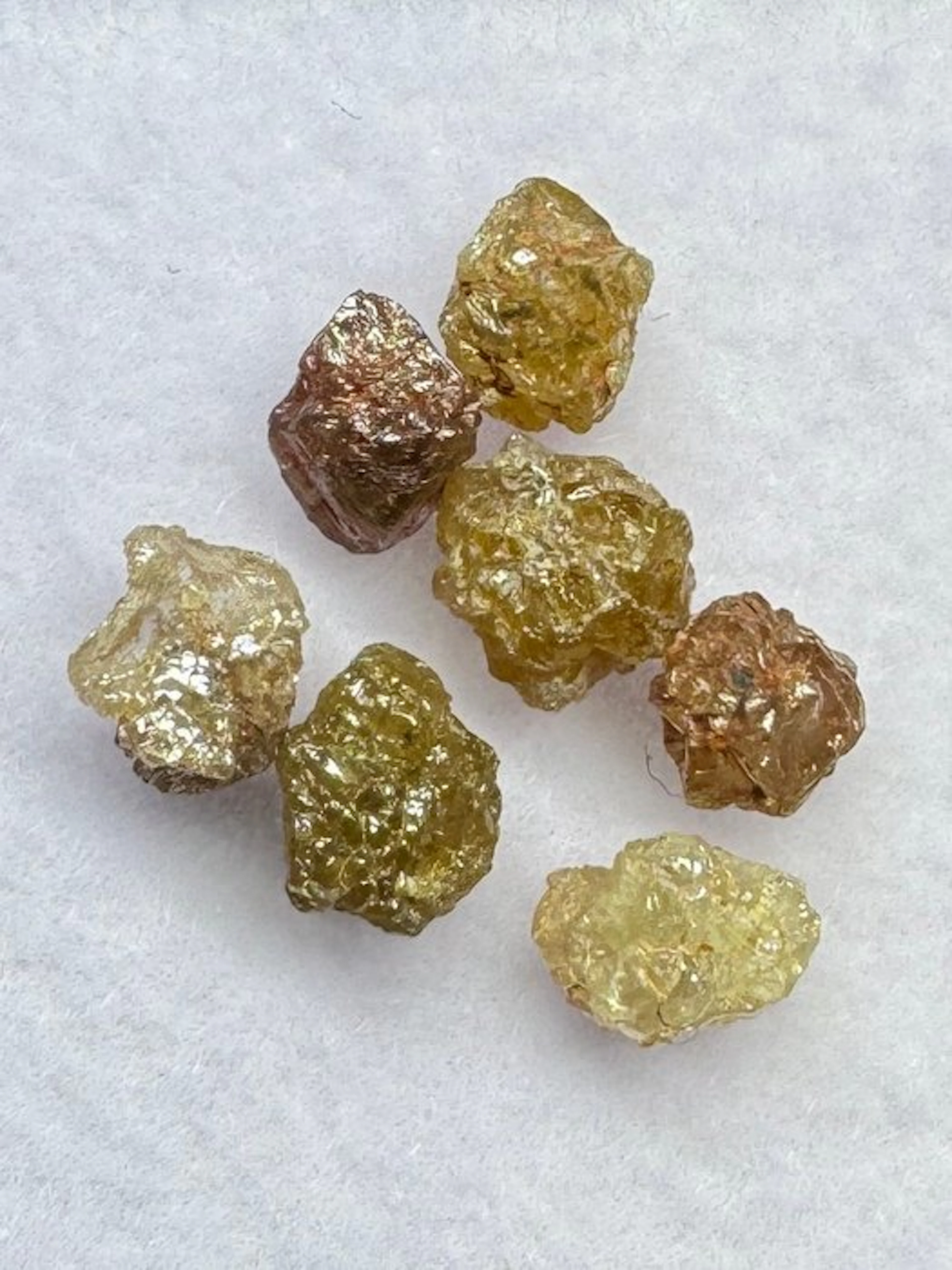 Lot of 7 orange-red rough diamonds