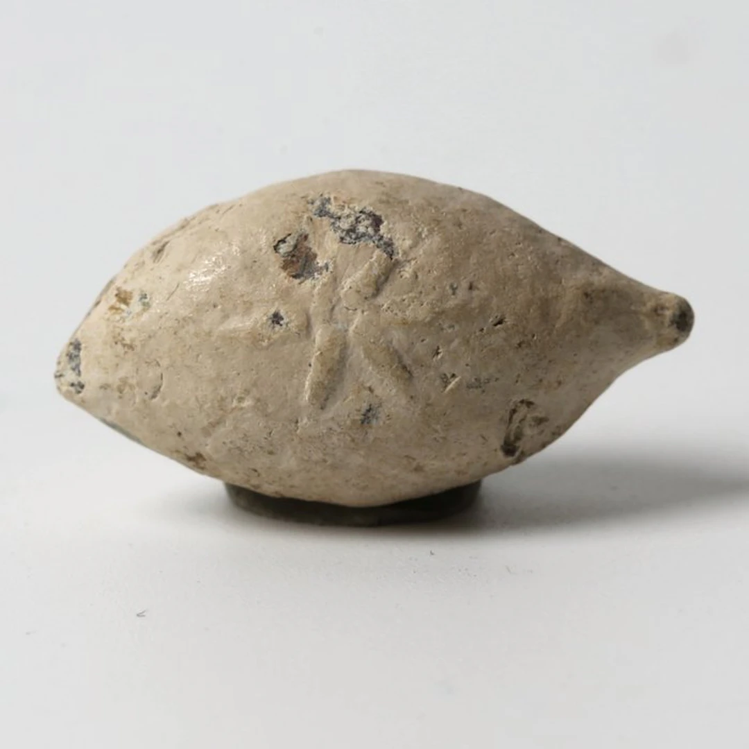 Ancient Greek Lead Sling bullet with symbol eight-ray star (No reserve price)