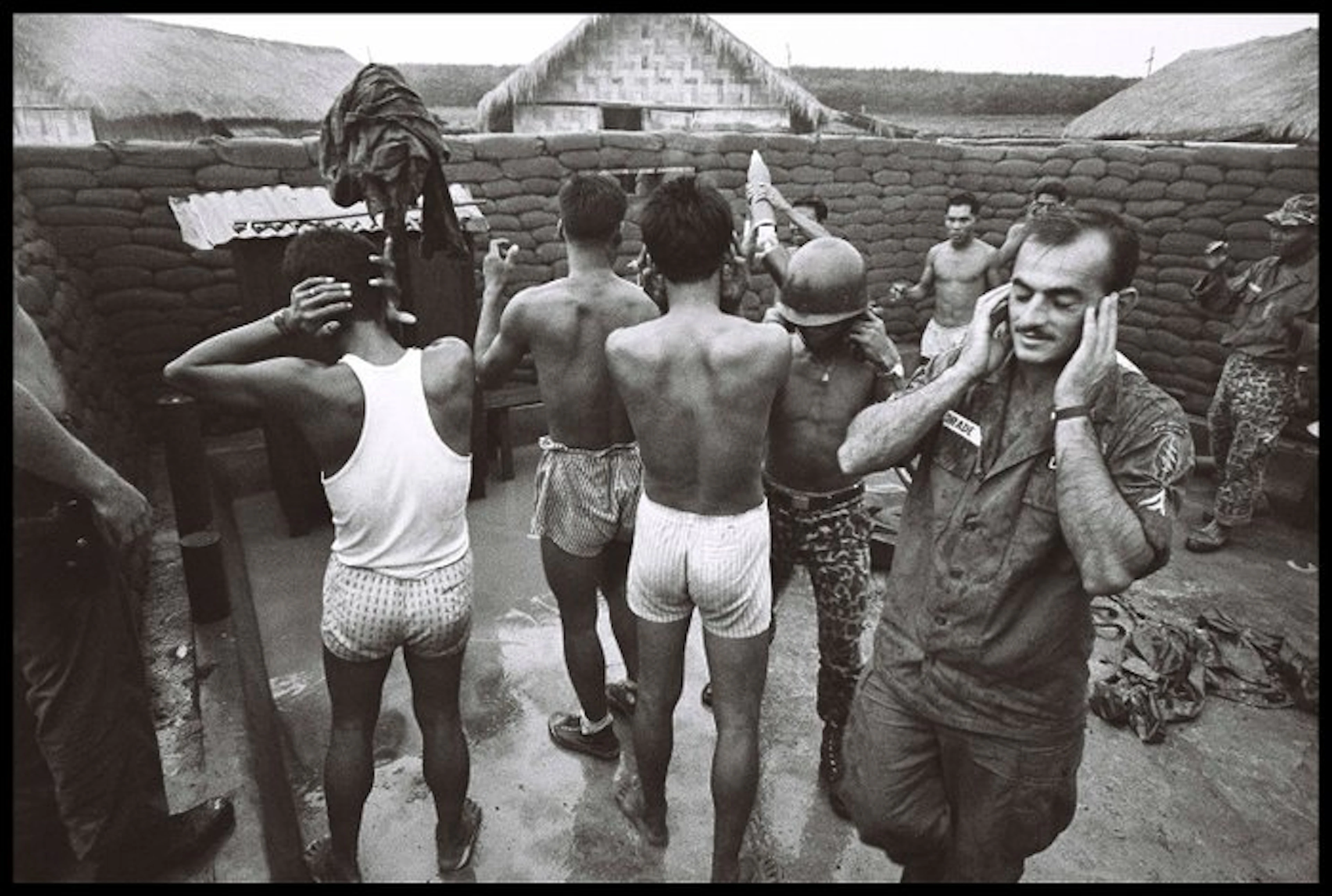 Michael Joseph (1941-) - Hands on Heads, Vietnam 1964