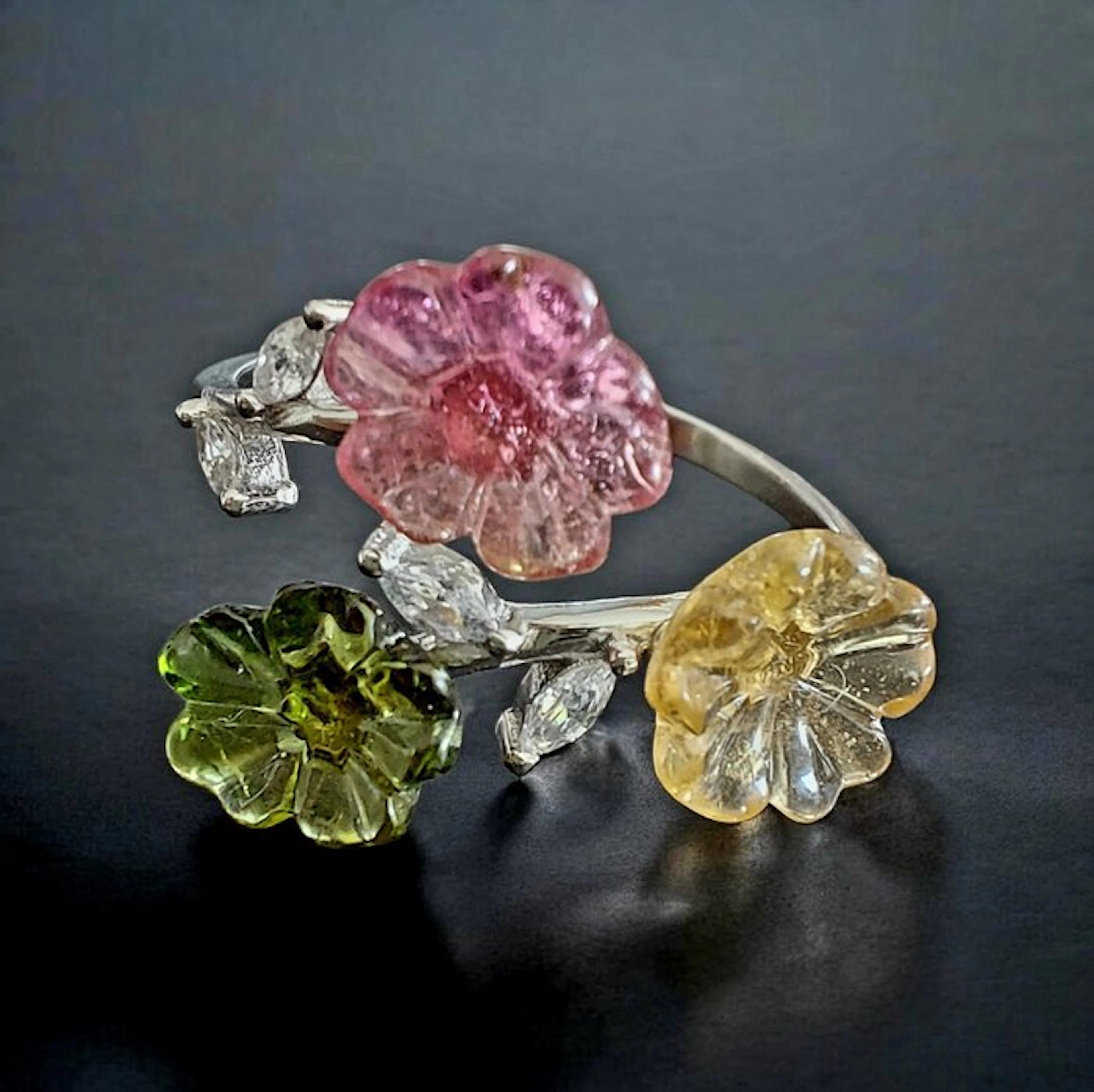 Delicate flowers in multicolored tourmaline sculpted on sterling silver