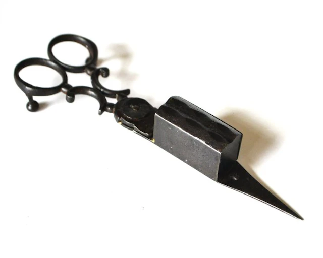Antique wrought iron candle snuffer