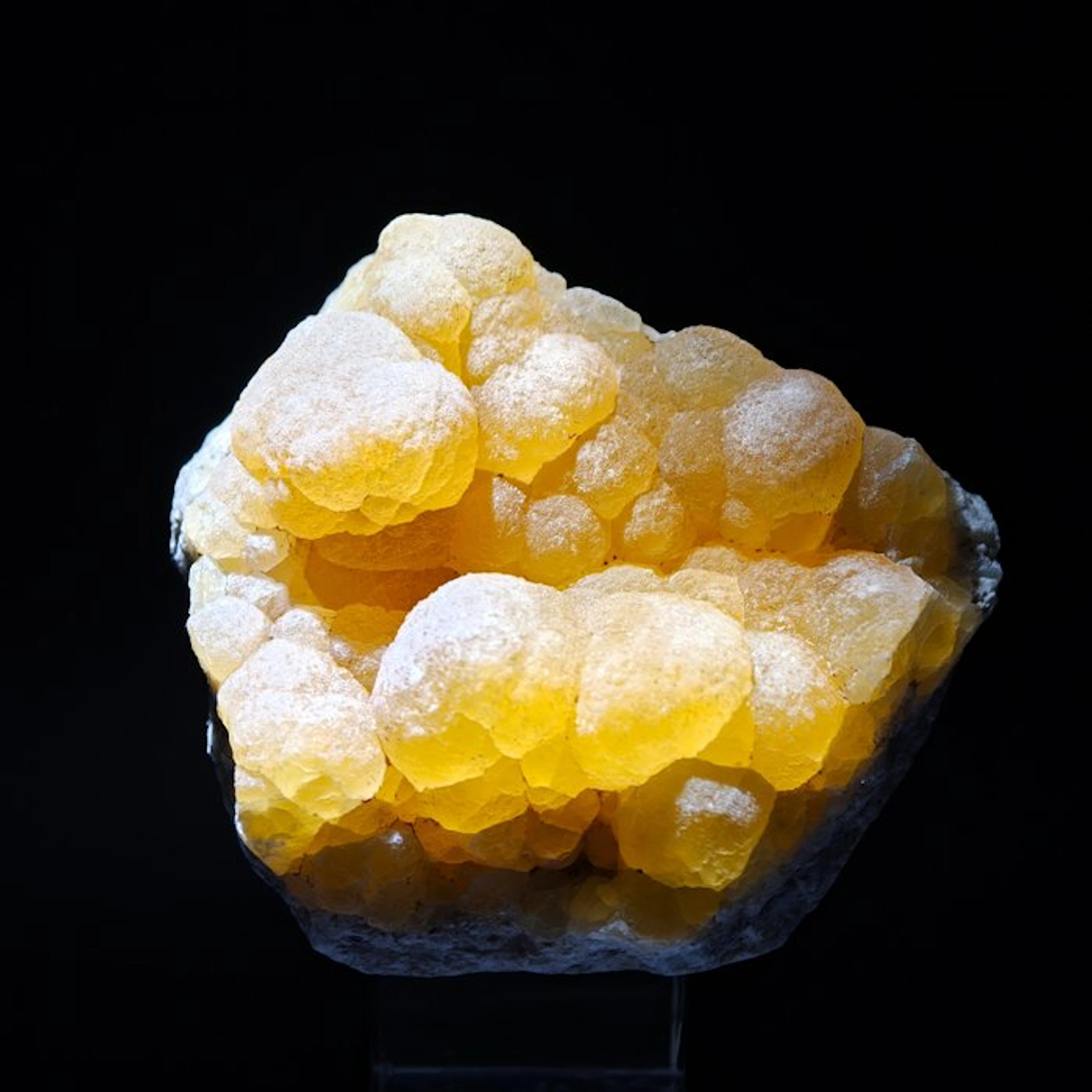 Yellow spherical fluorite on quartz