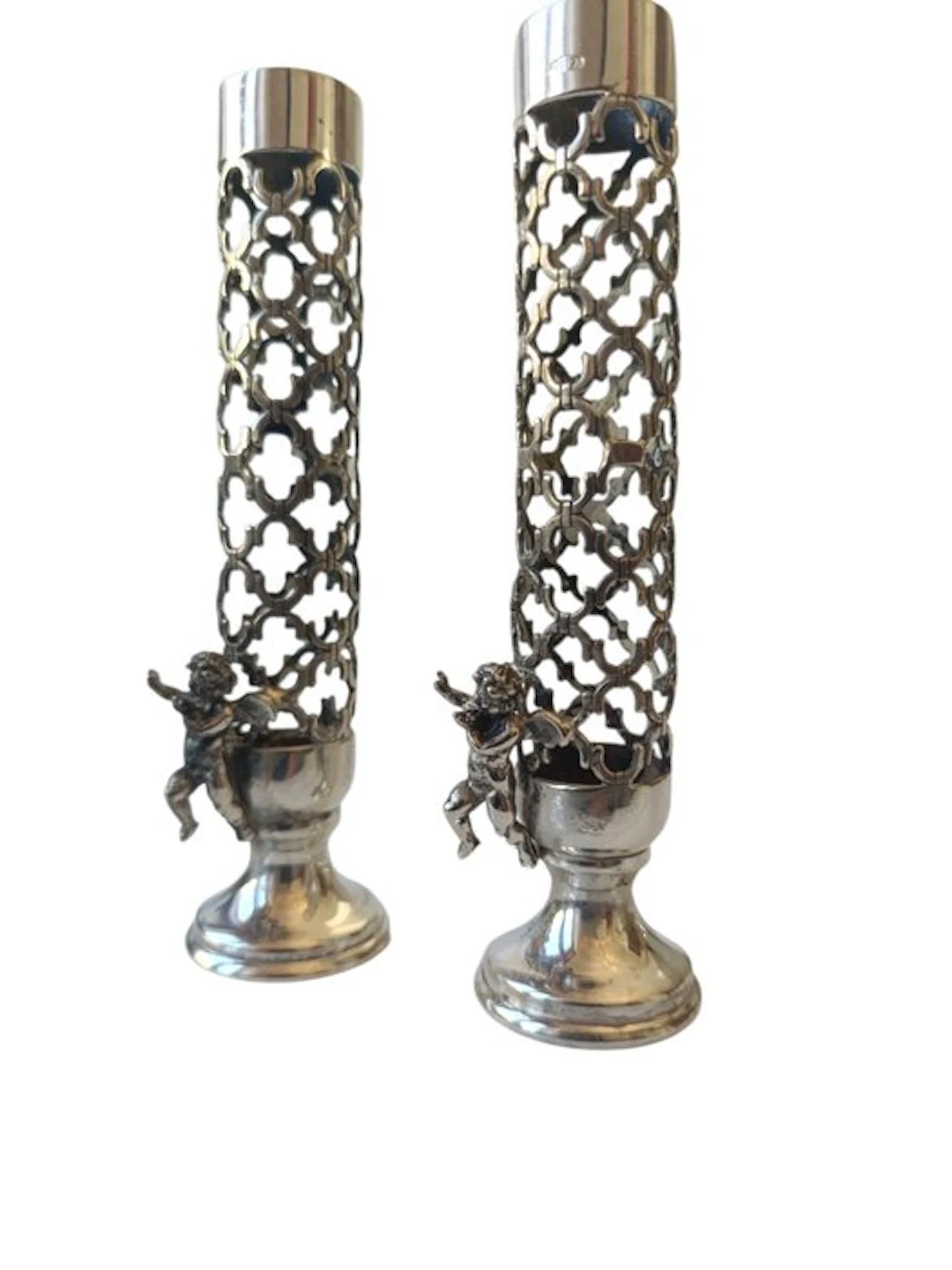Candlestick - Silver 800. Cylindrical body perforated at the base; two cherubs.