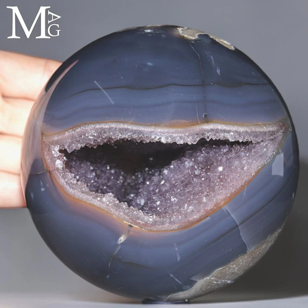 Agate Sphere with a Captivating Internal Geode Cavity...