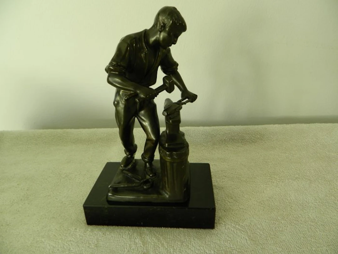 Figurine - smid bij aambeeld - Tin