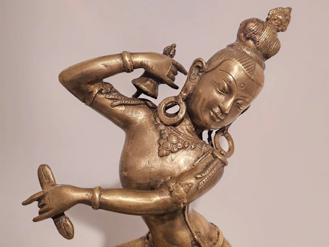 Brass figurative statue depicting a dancing Dakini...