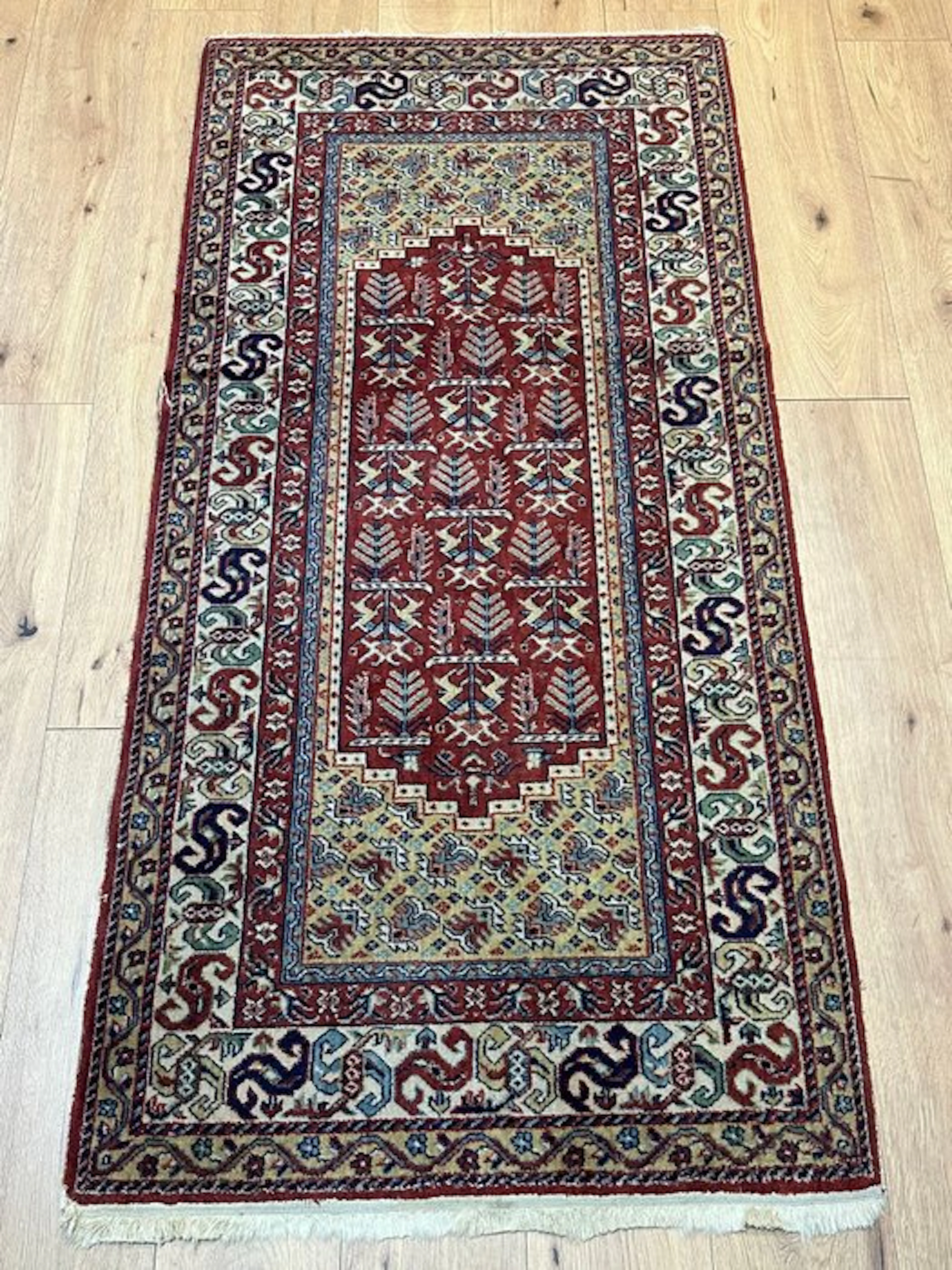 Hand-knotted Oriental rug with a traditional pattern and harmonious coloring