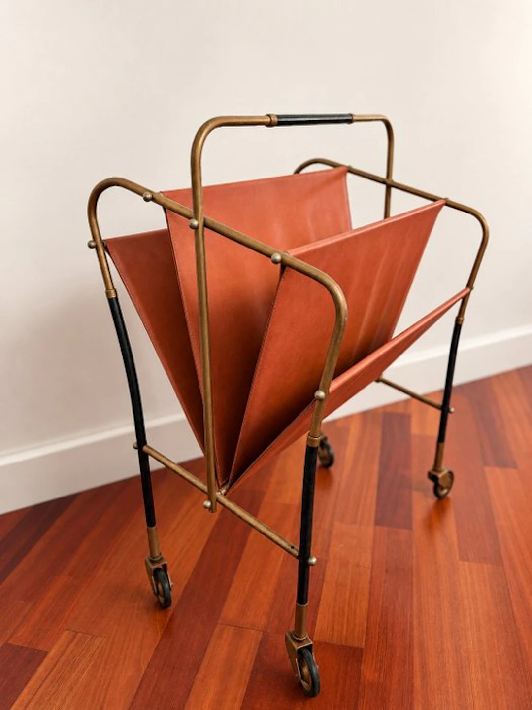 Magazine rack - Brass-toned metal and faux leather.