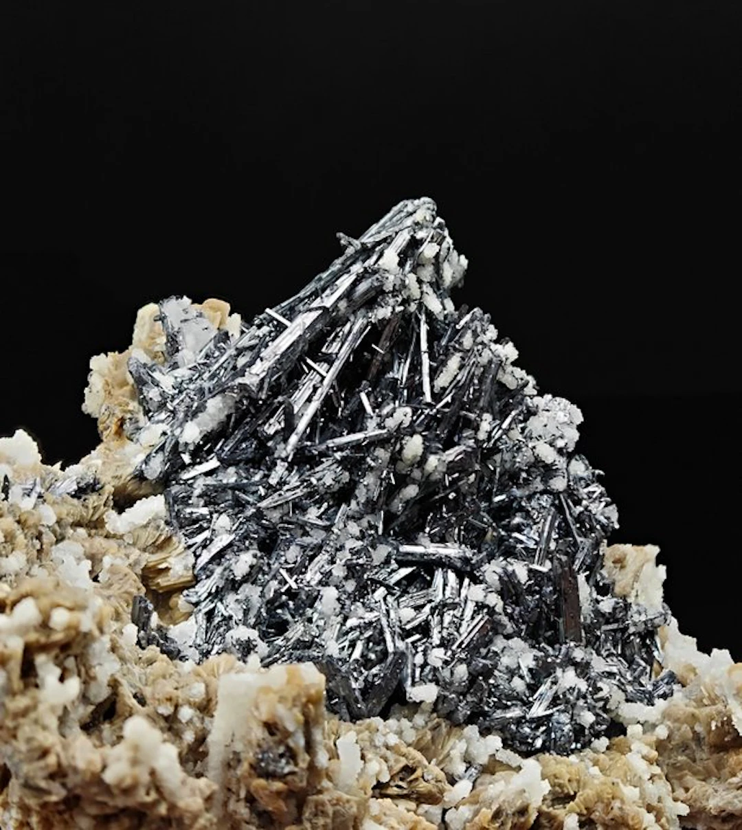 Shiny stibnite appearance with quartz on yellow dolomite...