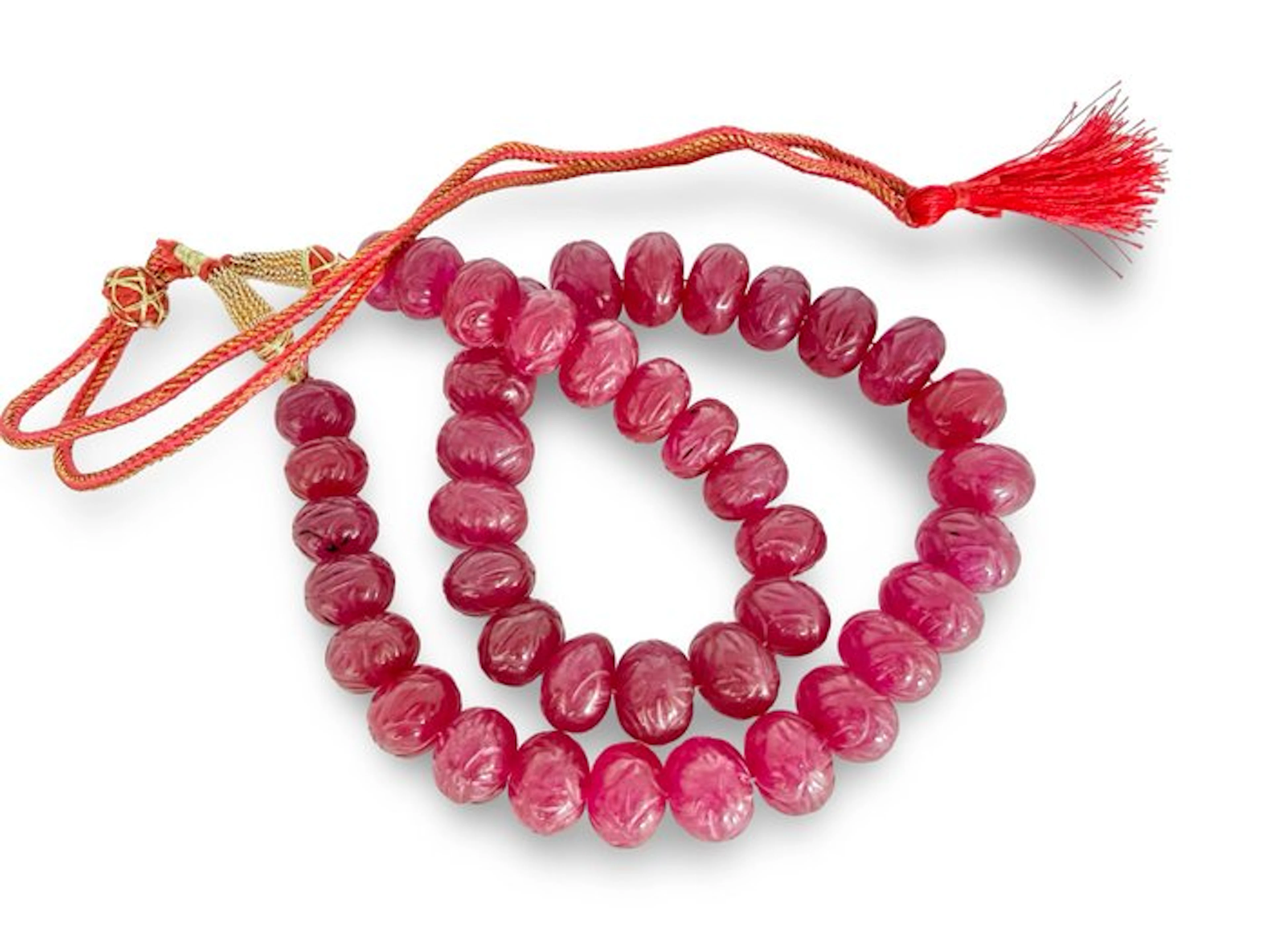 Approximately 42 handmade ruby-colored quartz beads from India- 160 g