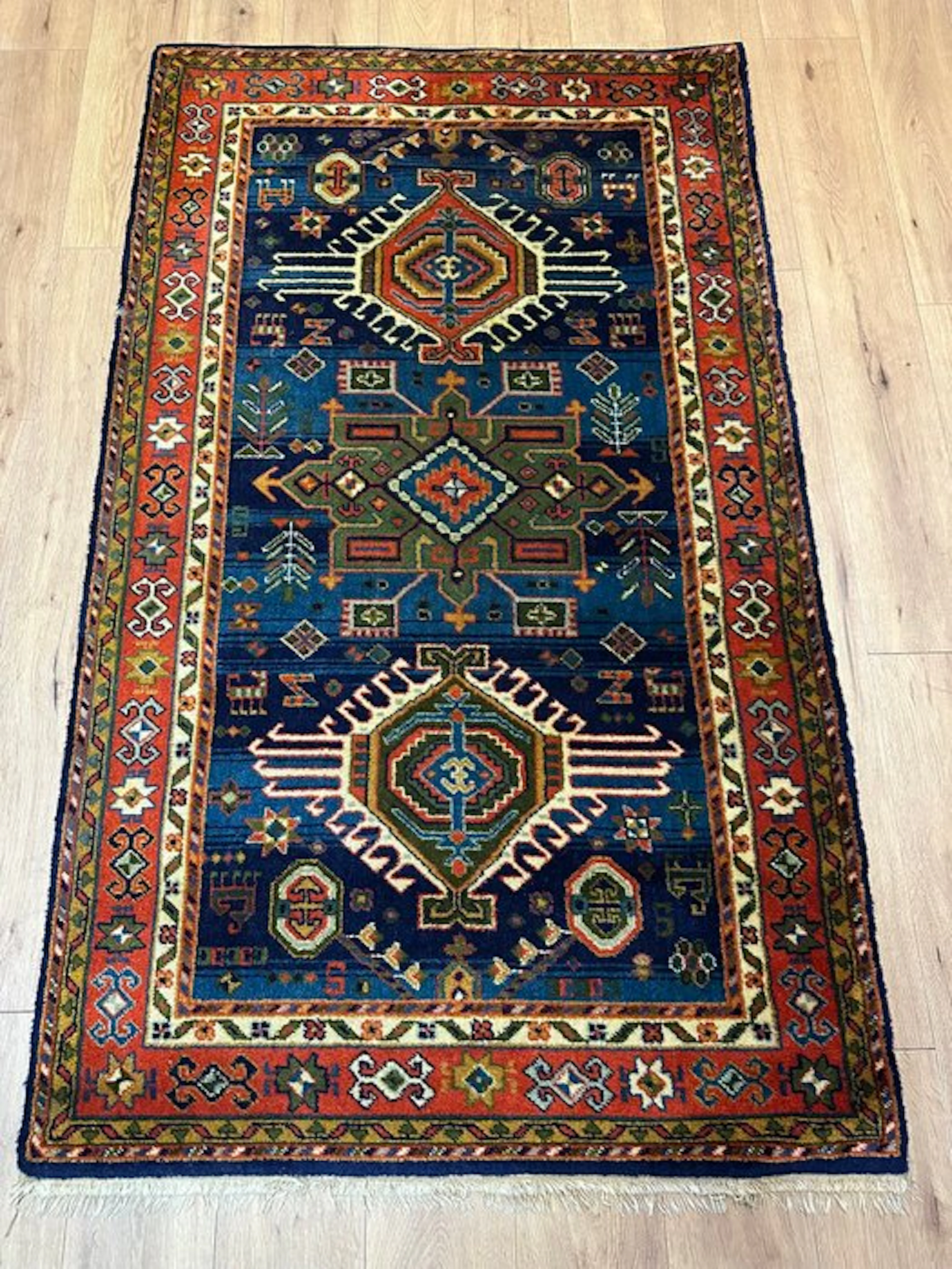 Woven Kazak Oriental rug – Geometric medallions...