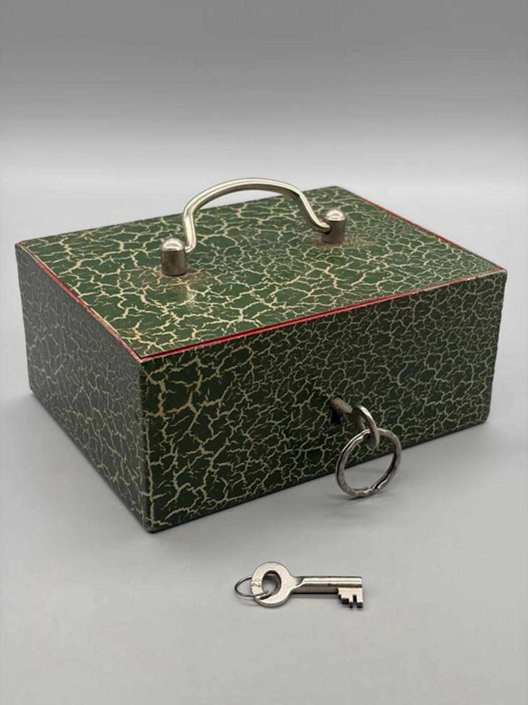 Casket - Antique metal valuables box with a craquelé green-and-red finish