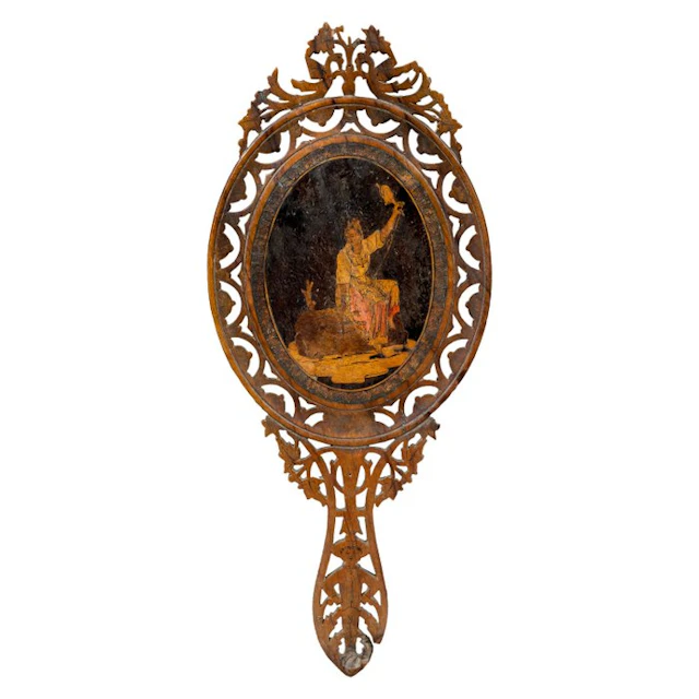 Hand mirror in carved