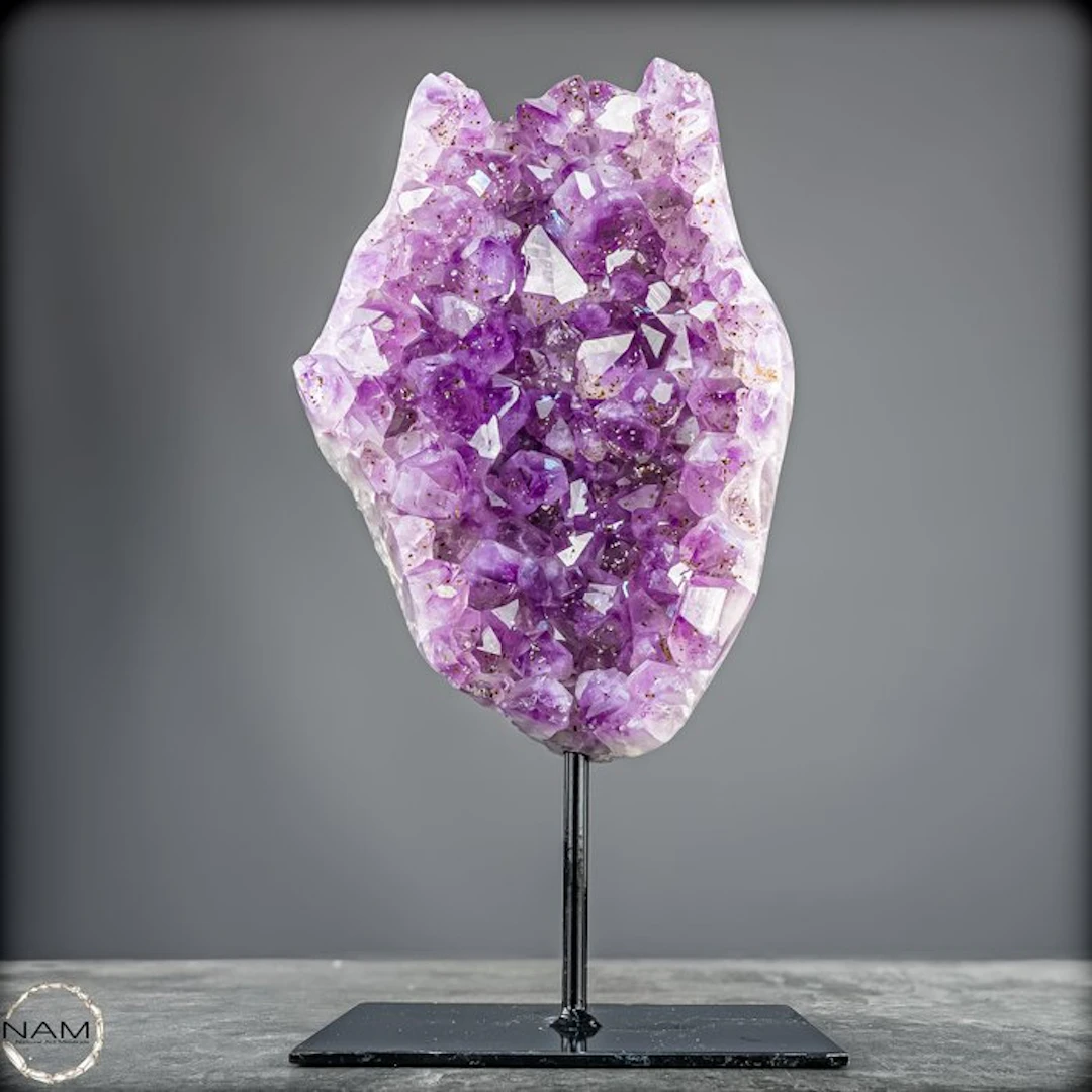 Stunning amethyst on a stand — majestic crystal energy in an elegant display